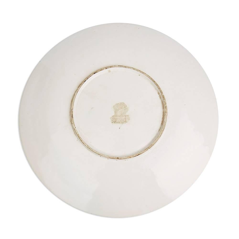 Terre de faïence dish, 1953, from the edition of an unknown size (Alain Ramié states that only a few copies of this subject were produced).

The dish is centrally decorated with a design comprising of a matador brandishing his capote de brega, a