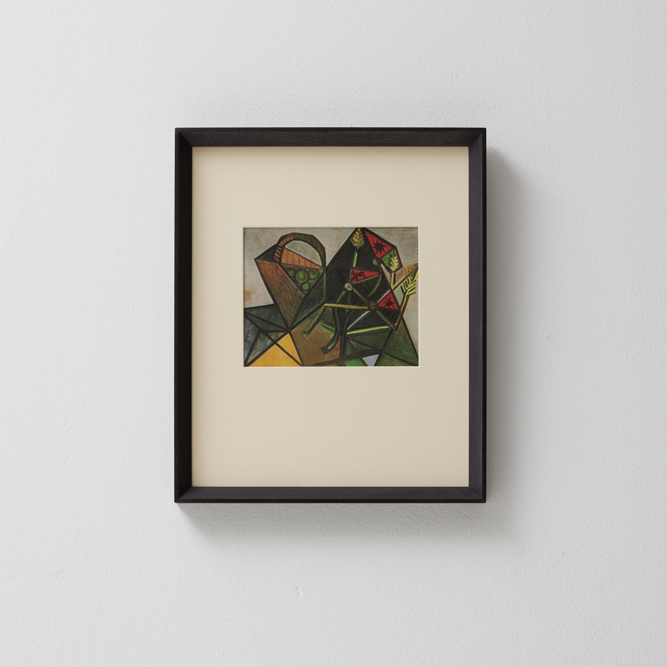 Tauchen Sie ein in die zeitlose Brillanz von Pablo Picasso mit diesem außergewöhnlichen Farbklischee, das 1943 von den Editions du Chêne in Paris, Frankreich, fachmännisch herausgegeben wurde. In einem wunderschönen Massivholzrahmen mit einer Breite