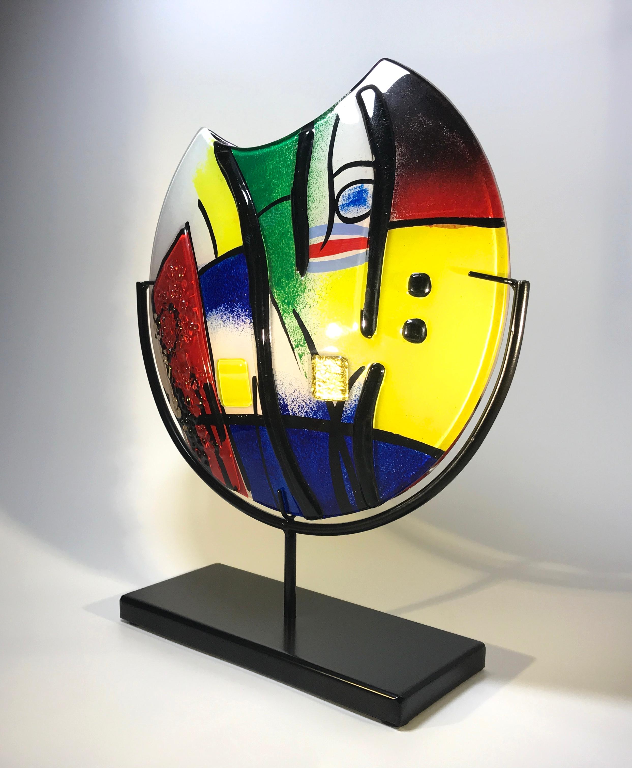 Distinct and stylish fused glass Italian vase, inspired by the master of Modern Art, Pablo Picasso
An impressive piece mounted on an oblong black metal stand,
circa early 21st century
Measures: Height 15 inch, width 12.5 inch, depth 4 inch
In