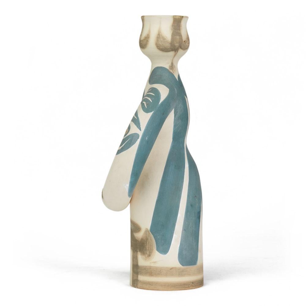 A Pablo Picasso (1881-1973) limited edition 'Lampe Femme' white earthenware vase of stylized female form with blue and brown partially glazed decoration. The vase has impressed Madoura Plein Feu/Edition Picasso marks to the base and has painted