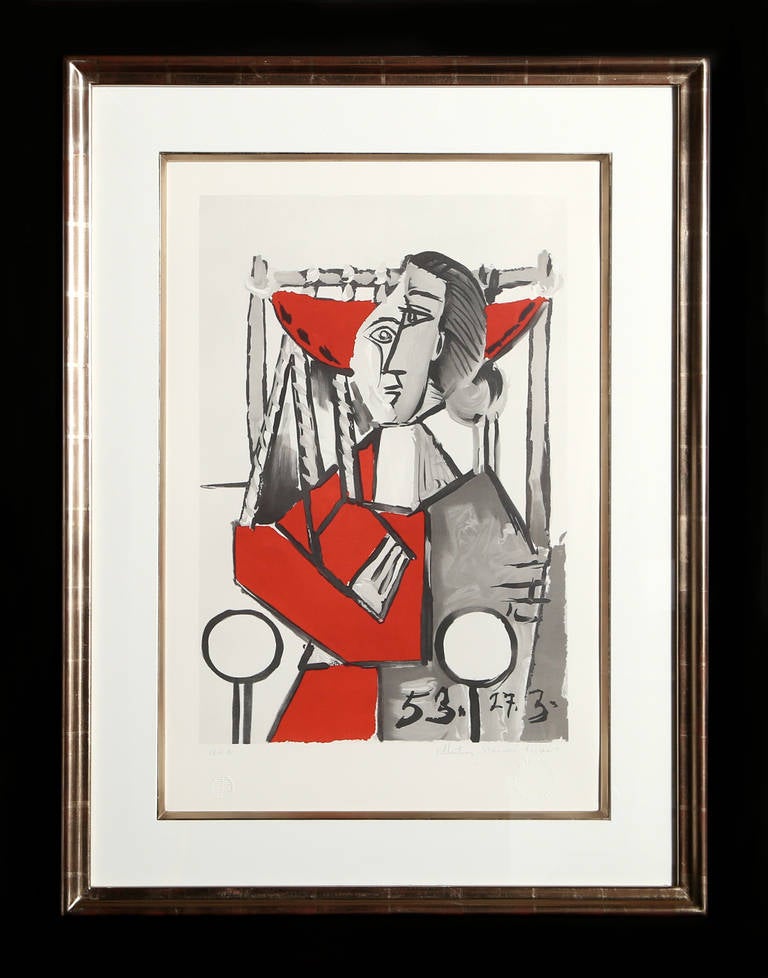 Pablo Picasso's portrayal of a woman in an armchair is a classic example of his avant-garde Cubist style. Rendered as a series of angular shapes and thick lines, the figure of the woman appears fragmented and reduced to mere shapes, forming new
