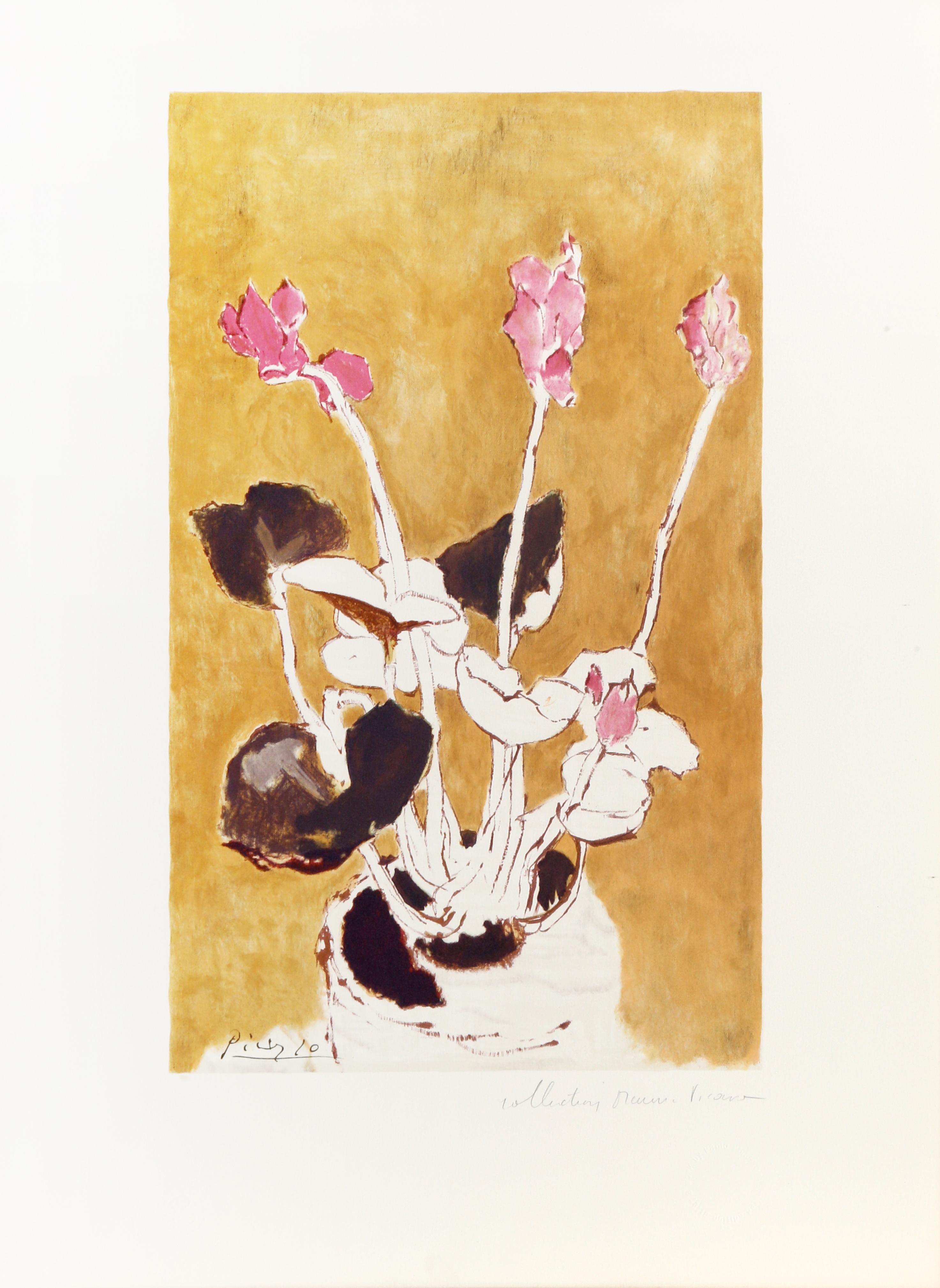 Resting on a surface against a golden yellow background, the pot of cyclamens is rendered with loose, flowing lines and minimal color. A lithograph from the Marina Picasso Estate Collection after the Pablo Picasso painting "Les Cyclamens". The