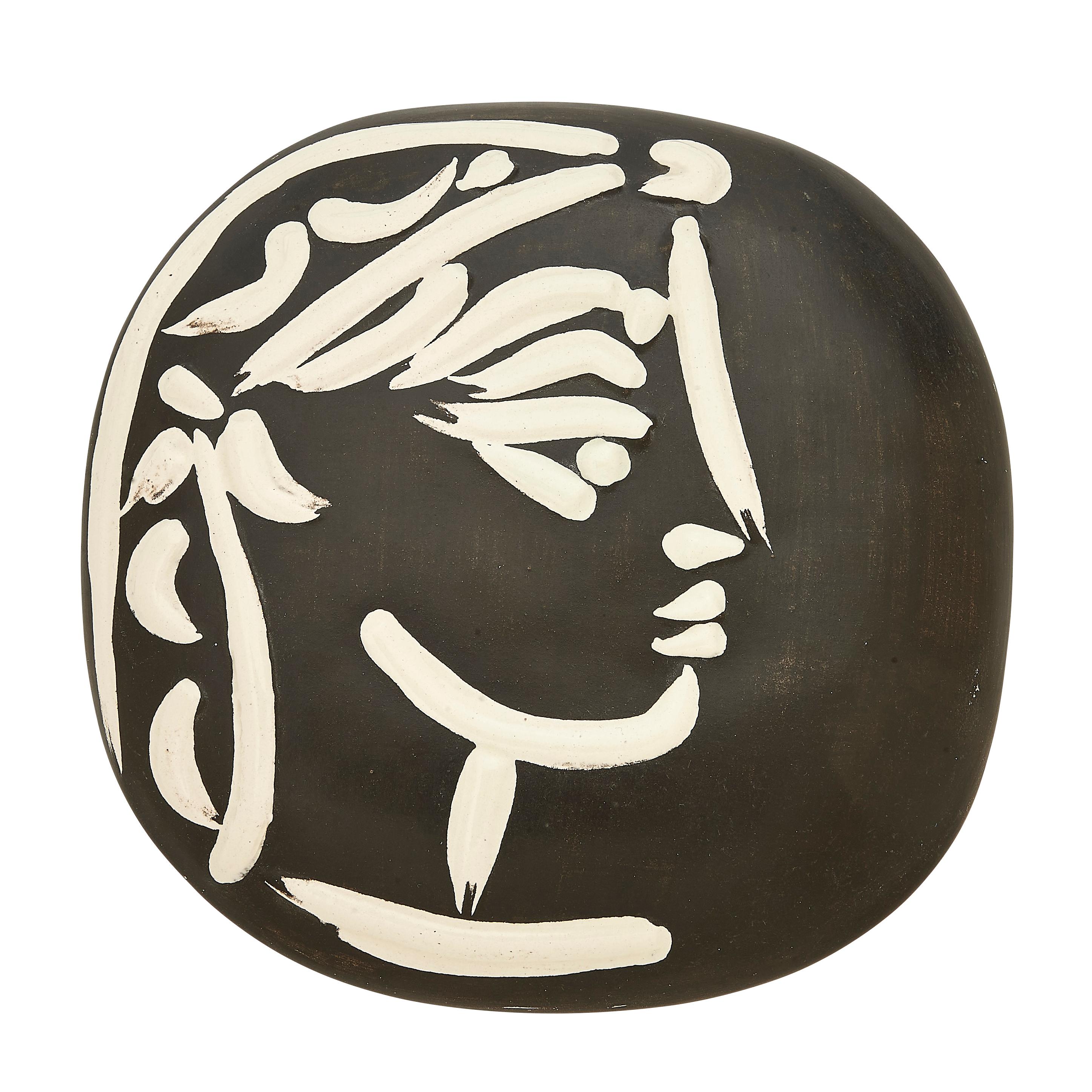 PABLO PICASSO (1881-1973) 
Jacqueline's profile (A. R. 385)

Terre de faïence plaque, 1956, from the edition of 500, partially glazed and painted, with the Empreinte Originale de Picasso and Madoura stamps.