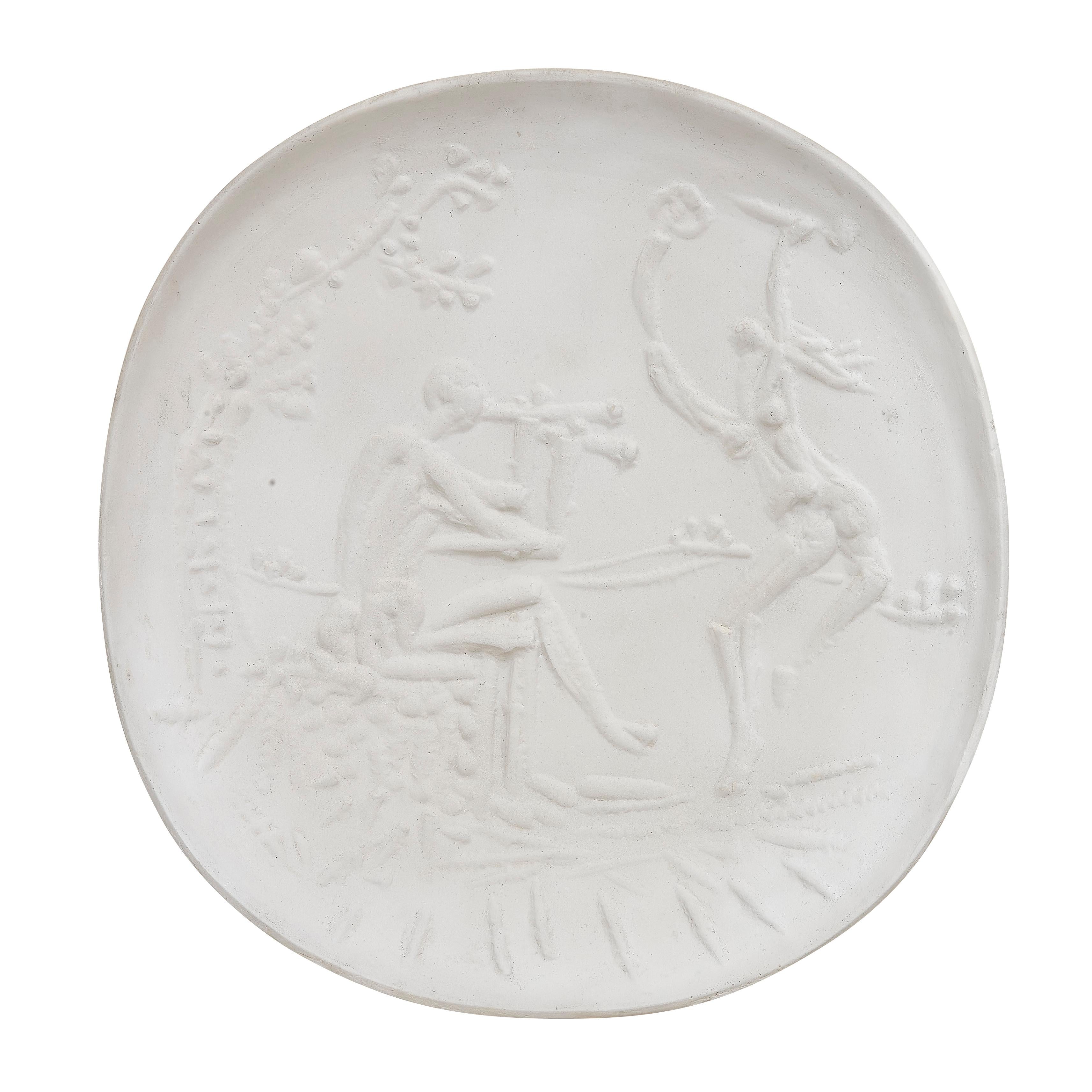 PABLO PICASSO (1881-1973) 
Joueur de diaule et faune (A. R. 342) 

Terre de faïence plate, 1956, with the workshop numbering, aside from the edition of 100, with the Empreinte Originale de Picasso and Madoura stamps.