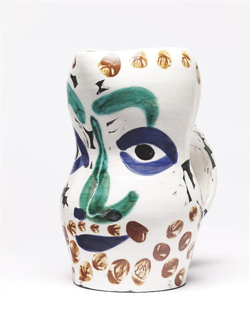 This Picasso ceramic pitcher " Visage aux points Ramié 610" is one in an edition of 350 and is made of white earthenware clay, and decorated with colored engobes and glaze.  

 Please contact us with any questions.