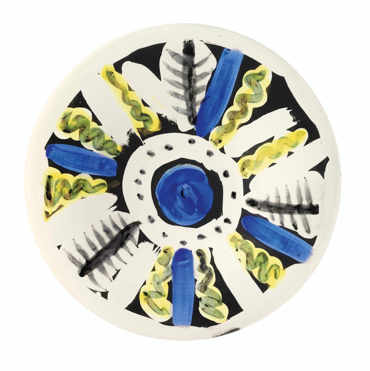 PABLO PICASSO (1881-1973) 
Motifs no. 66' (A. R. 472)

Terre de faïence plate, painted in colors and partially glazed, 1963, numbered 94/150 and inscribed 'No 66', 'Edition Picasso' and 'Madoura'.
