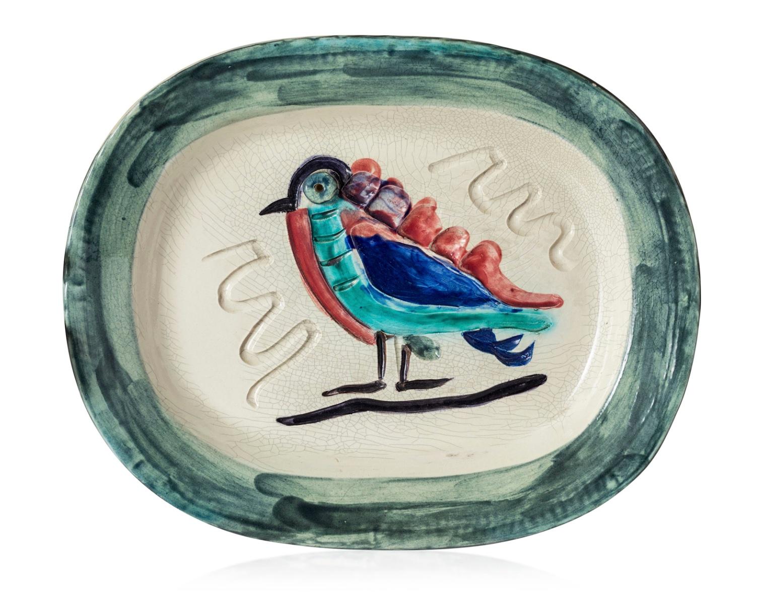 This Picasso ceramic plate "Oiseau polychrome' Ramié 33 is one in a small edition of 200. Stamped, marked and numbered 'Madoura Plein Feu / Edition Picasso. White earthenware ceramic plate, partially engraved, with colored engobe and glaze
This