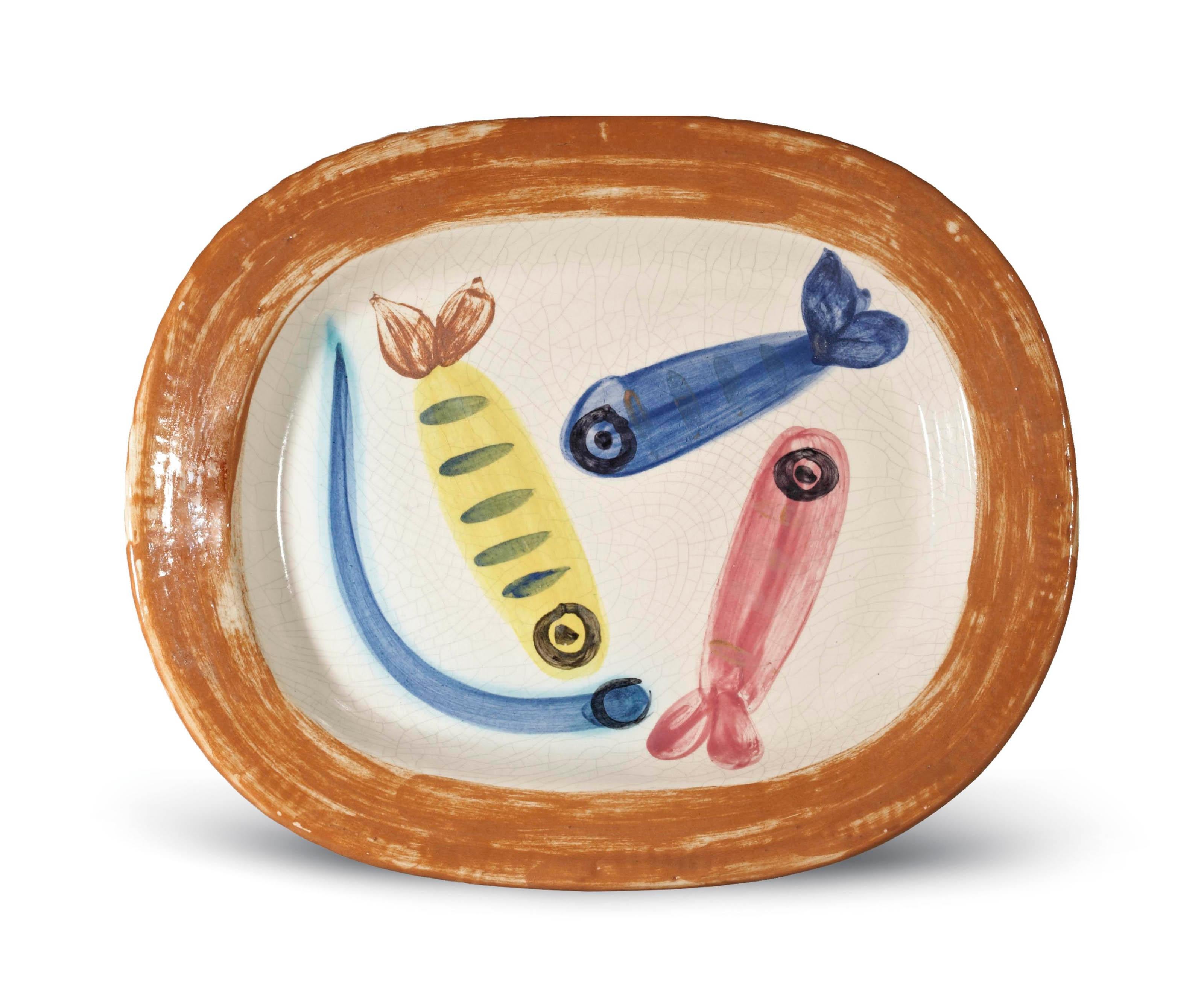 This Picasso ceramic plate "Quatre poissons polychromes Ramié 31" is one in an edition of 200 and is made of white earthenware clay, and decorated with colored engobes and glaze.   

Please contact us with any questions.
