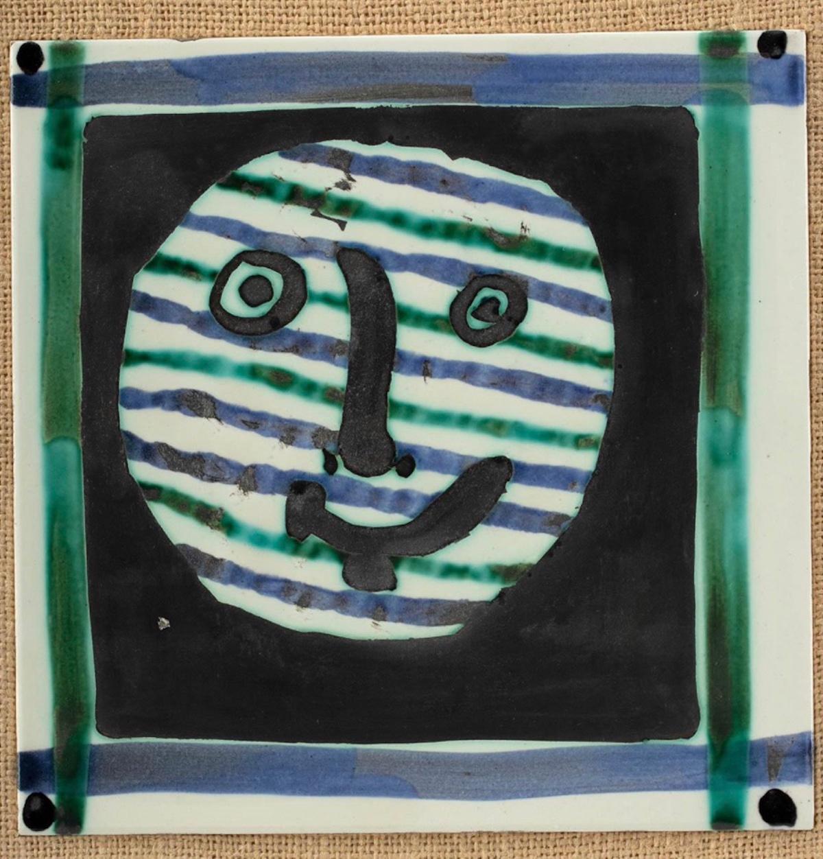 This Picasso ceramic tile 'Masque' Ramié 310 is number 154 of an edition of 300. This piece is partially glazed ceramic plaque beautifully painted and framed. Marked and numbered 'K121 / Edition Picasso / 154/300 / Madoura' on the reverse. Made of