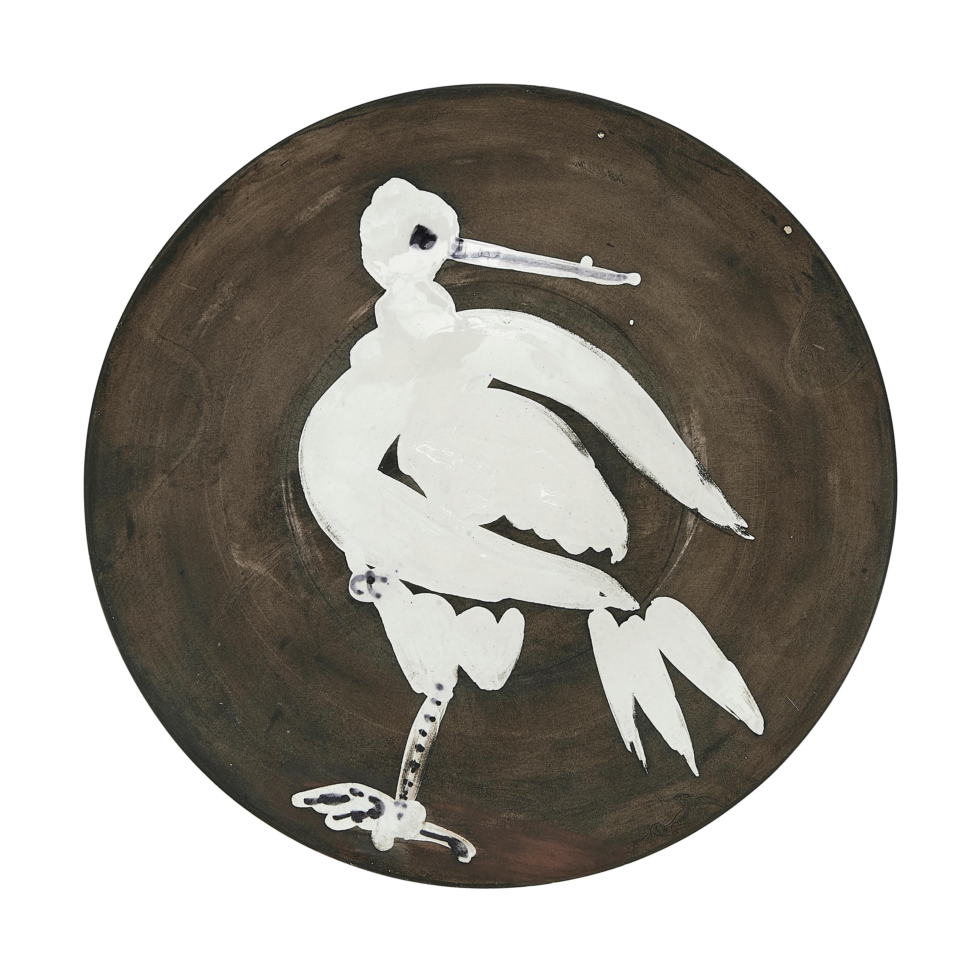 PABLO PICASSO (1881-1973) 
Oiseau No. 82 (A. R. 482) 

Ceramic plate, 1963, numbered 87/150, titled, inscribed 'Edition Picasso' and 'Madoura', partially glazed and painted.