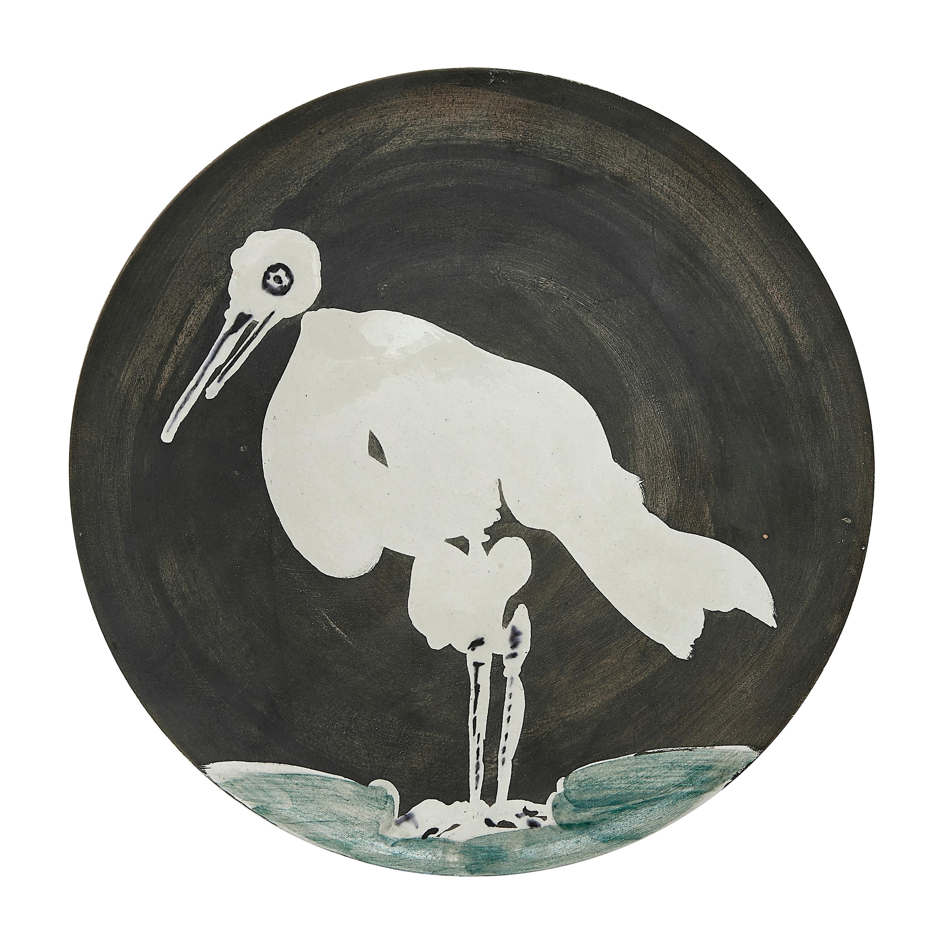PABLO PICASSO (1881-1973) 
Oiseau No. 83 (A. R. 483)

Terre de faïence plate, 1963, numbered 183/200, titled, inscribed 'Edition Picasso' and 'Madoura', partially glazed and painted.