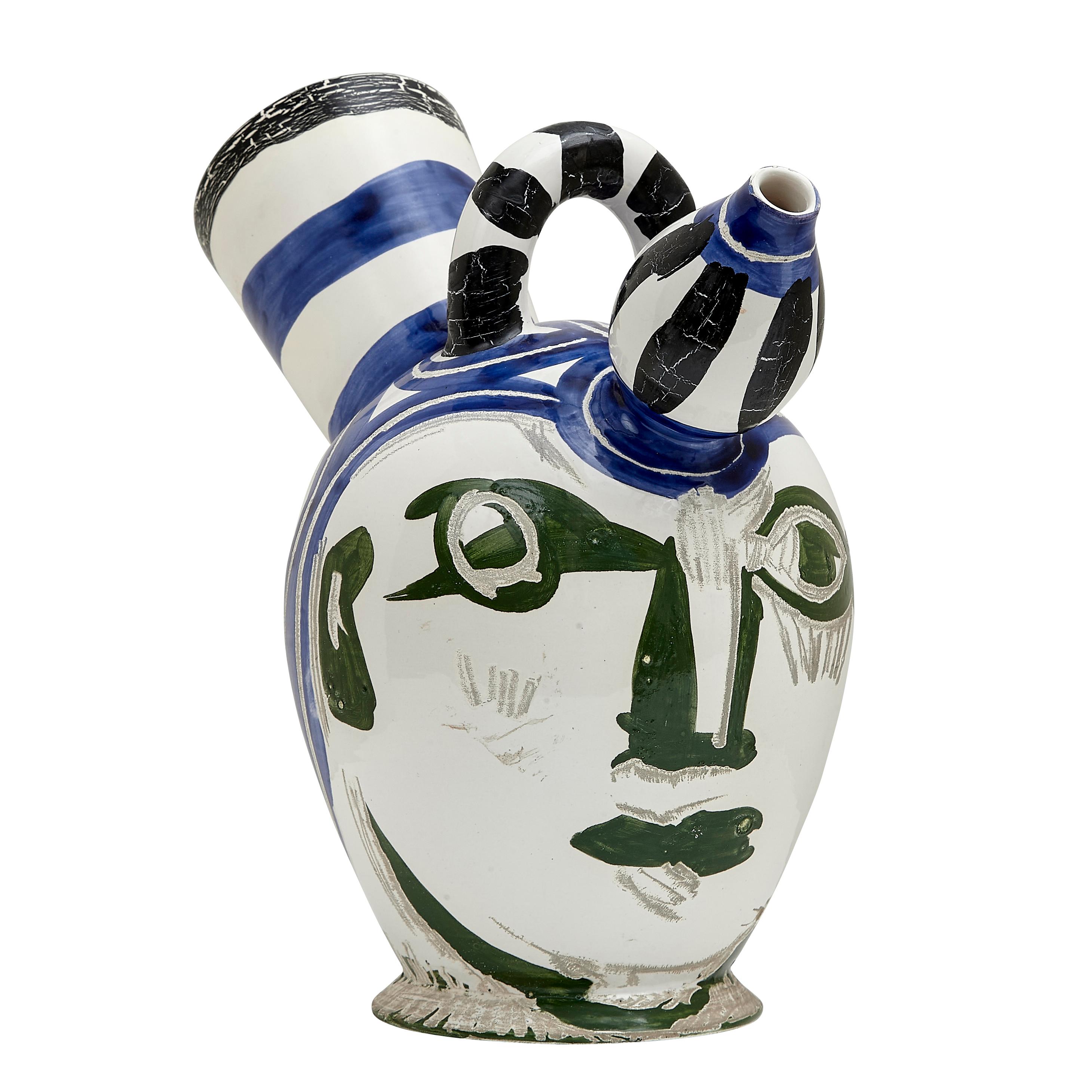 PABLO PICASSO (1881-1973) 
Pichet à glace (A. R. 143) 

Terre de faïence pitcher, painted in colors and partially glazed, 1952,  numbered 12/50 and inscribed Edition Picasso and Madoura, with the Edition Picasso and Madoura stamps.