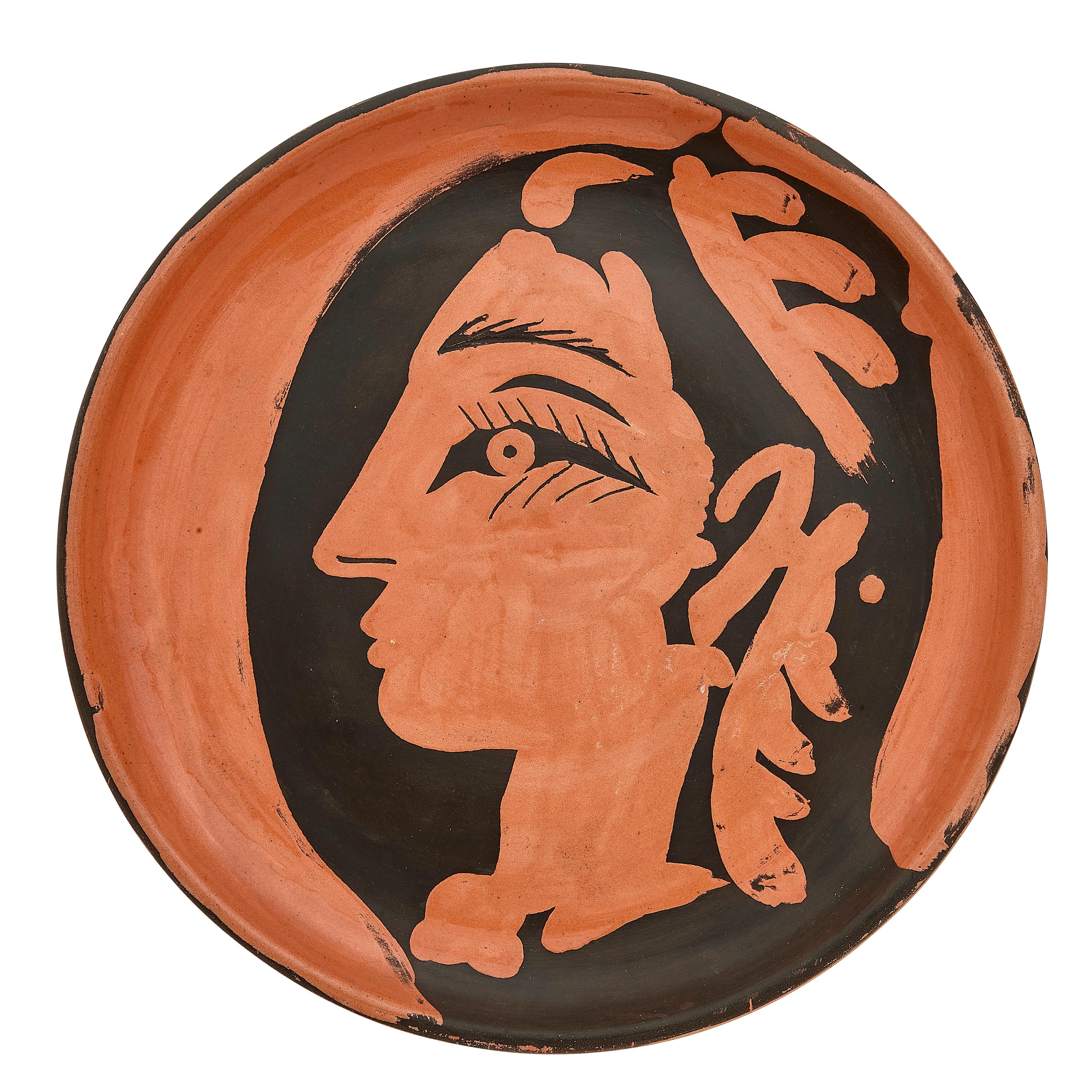 PABLO PICASSO (1881-1973) 
Profil de Jacqueline (A. R. 457) 

Terre de faïence plate, painted colors and partially glazed, 1962, numbered 83/100 and inscribed Edition Picasso, with the Edition Picasso and the Madoura stamps.
