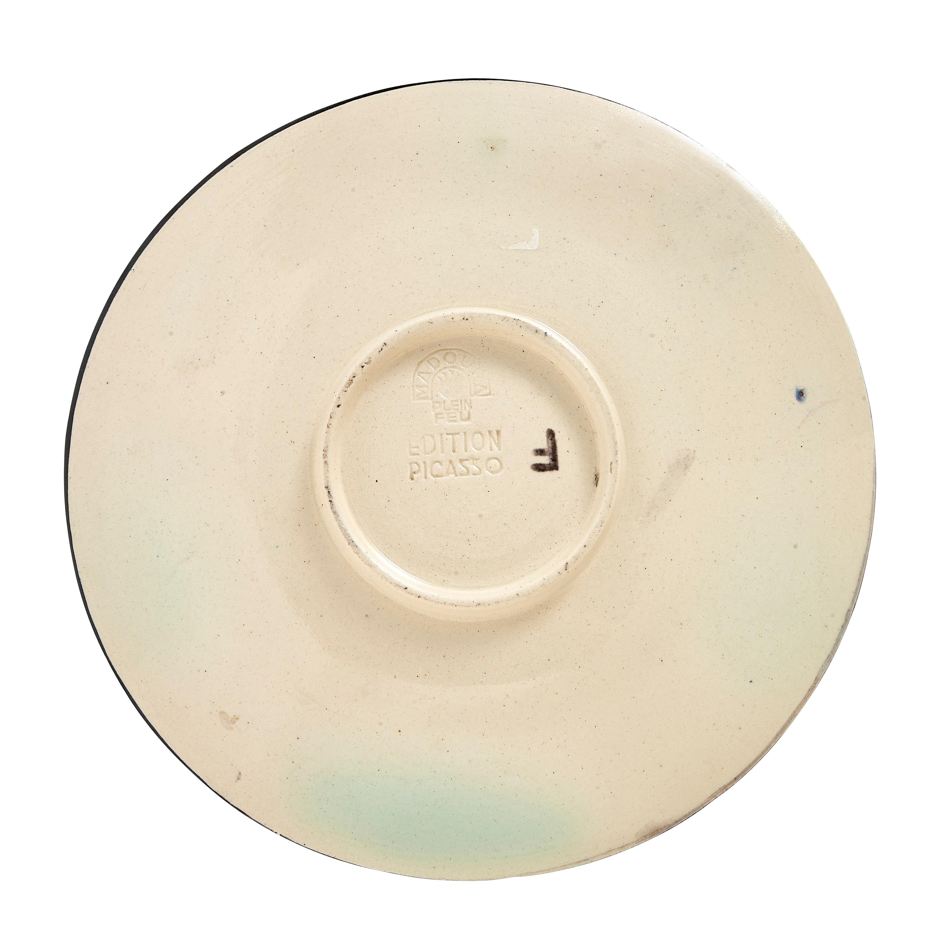 PABLO PICASSO (1881-1973) 
Service visage noir (A. R. 41)

Terre de faïence plate, painted in colors and glazed, 1948, from the edition of 100, inscribed 'F', 'd'après Picasso' and 'Madoura', with the Madoura stamp.