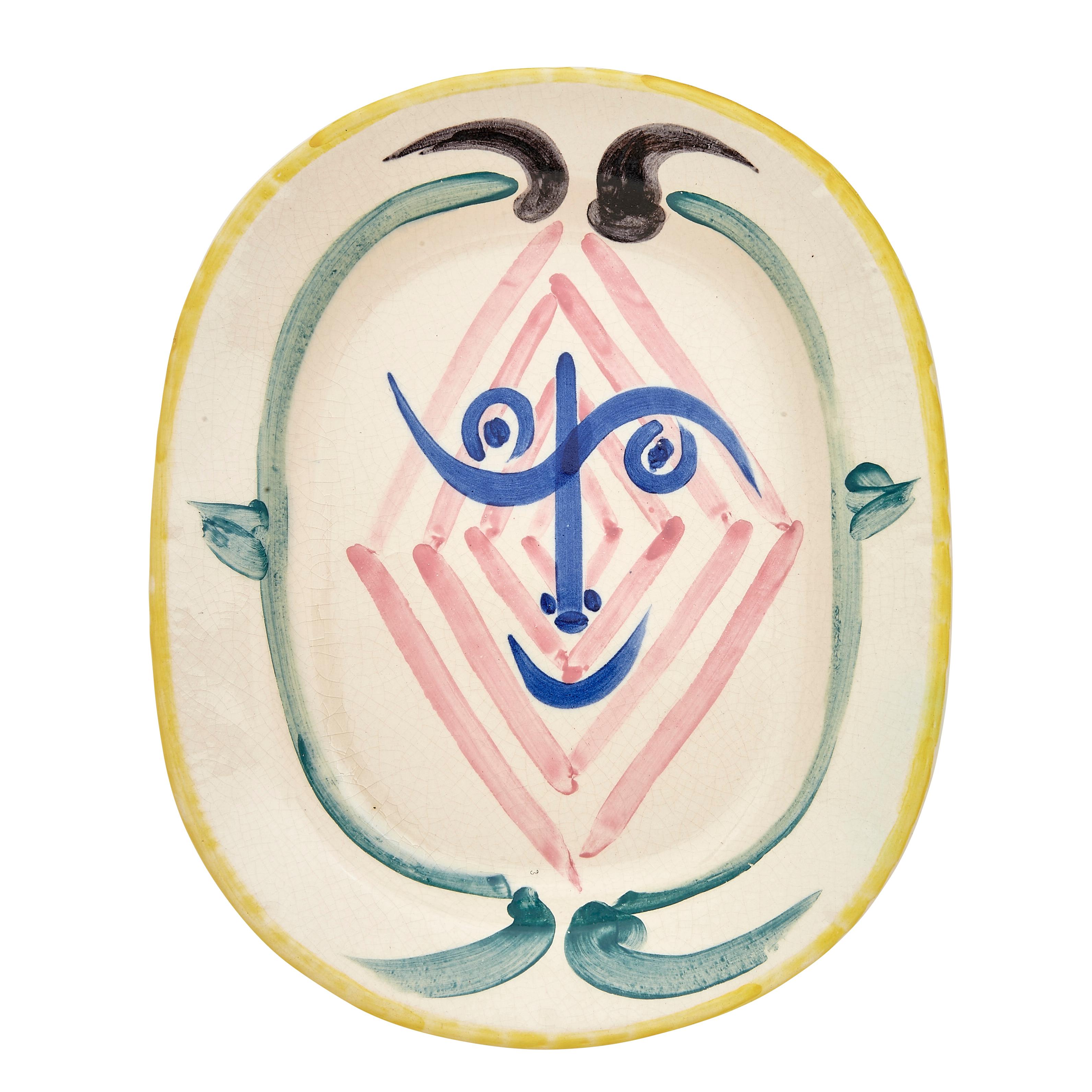 PABLO PICASSO (1881-1973) 
Tête de faune (A. R. 51)

Terre de faïence dish, 1948, numbered 132/300, with the workshop numbering, glazed and painted, with Edition Picasso and Madoura stamps.