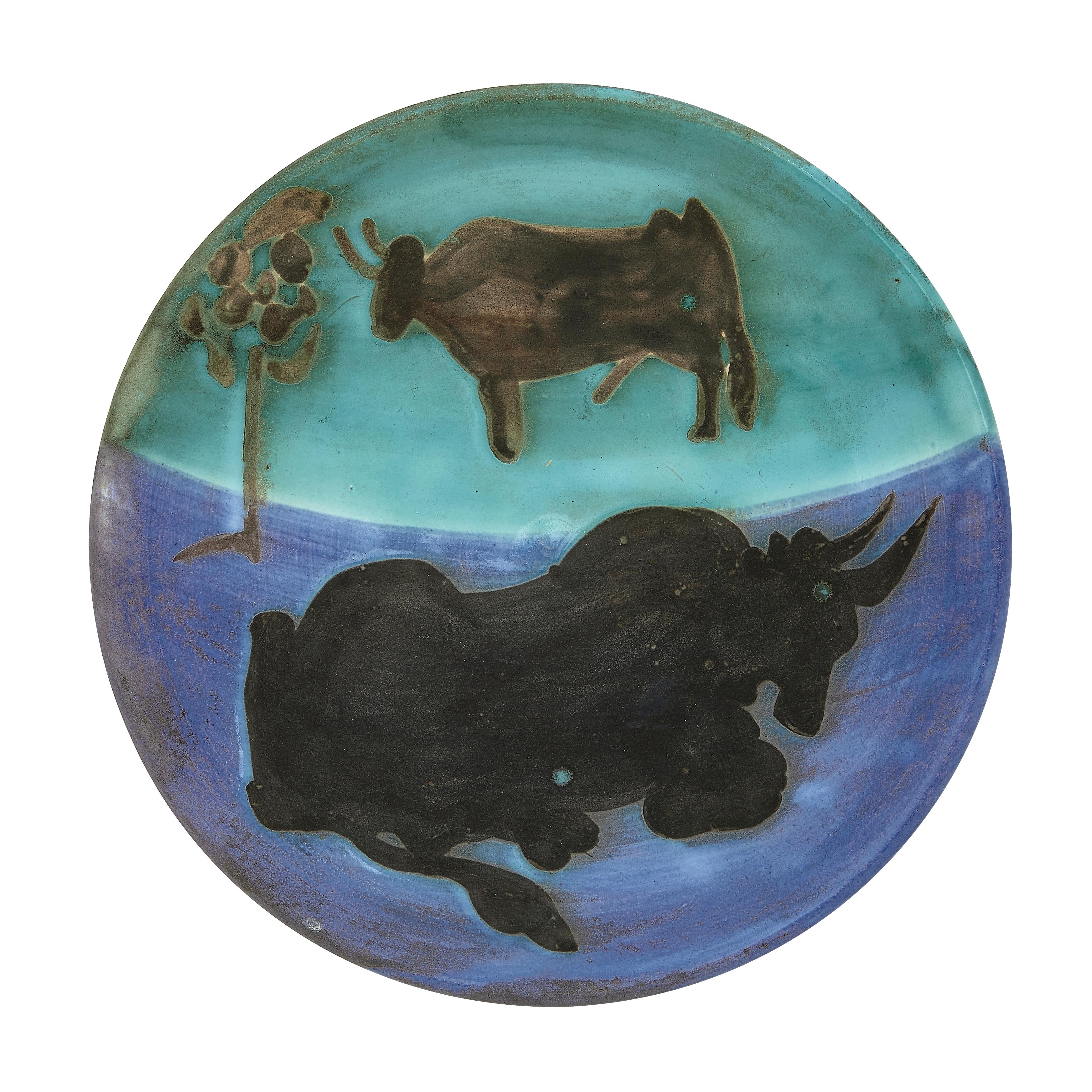 PABLO PICASSO (1881-1973) 
Toros (A. R. 161) 

Terre de faïence plate, 1952, from the edition of 500, incised 'Edition Picasso', partially glazed and painted, with the Edition Picasso and Madoura stamps.