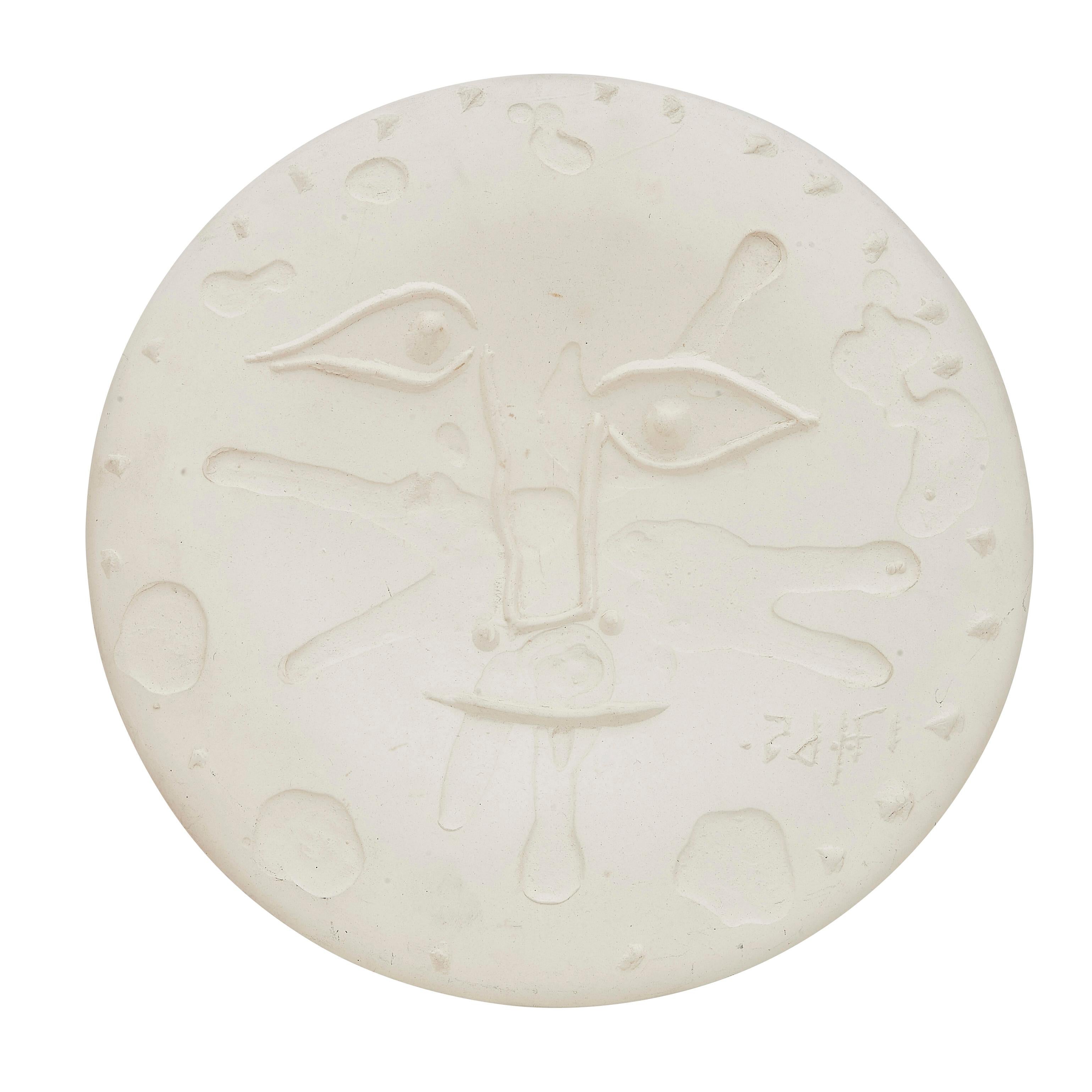 PABLO PICASSO (1881-1973) 
Visage (A. R. 533) 

Terre de faïence plate, 1965, numbered 9/100, with the workshop numbering, with the Empreinte Originale de Picasso and Madoura stamps."