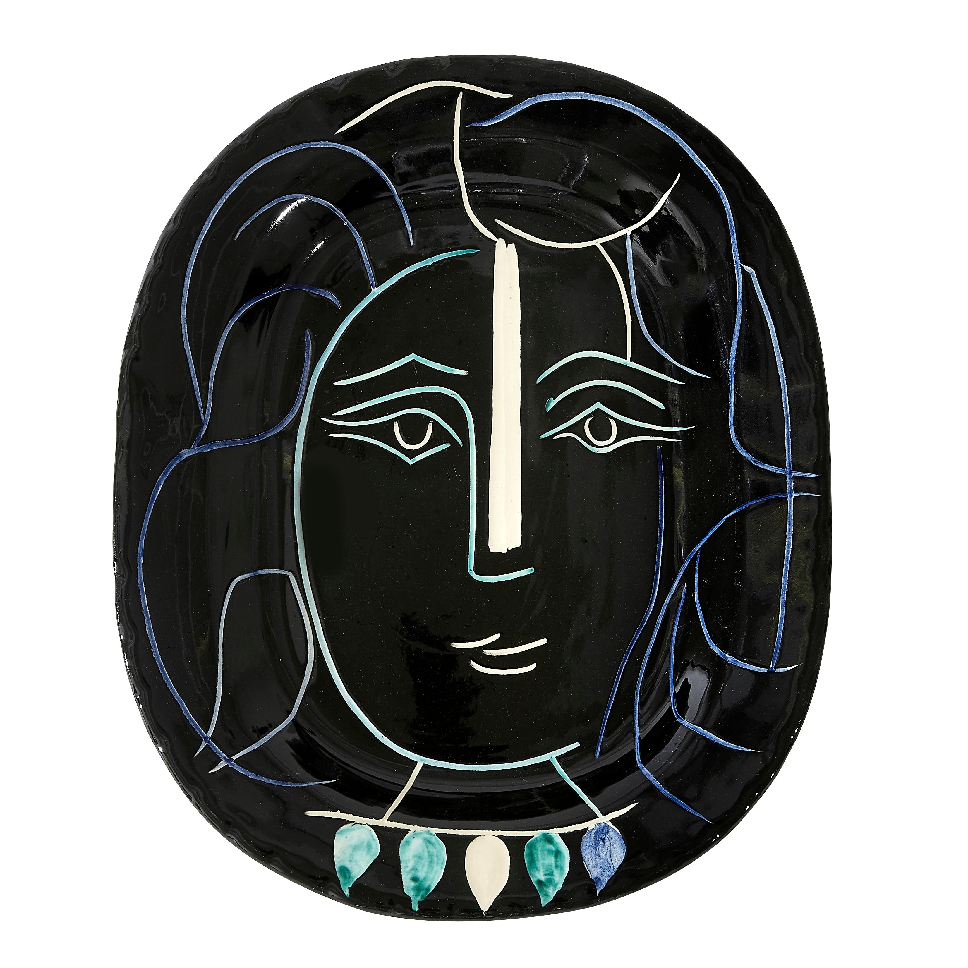 PABLO PICASSO (1881-1973) 
Visage de femme (A. R. 220)

Terre de faïence dish, 1953, from the edition of 400, inscribed 'Edition Picasso' and 'Madoura', glazed and painted, with the Edition Picasso and Madoura stamps.
