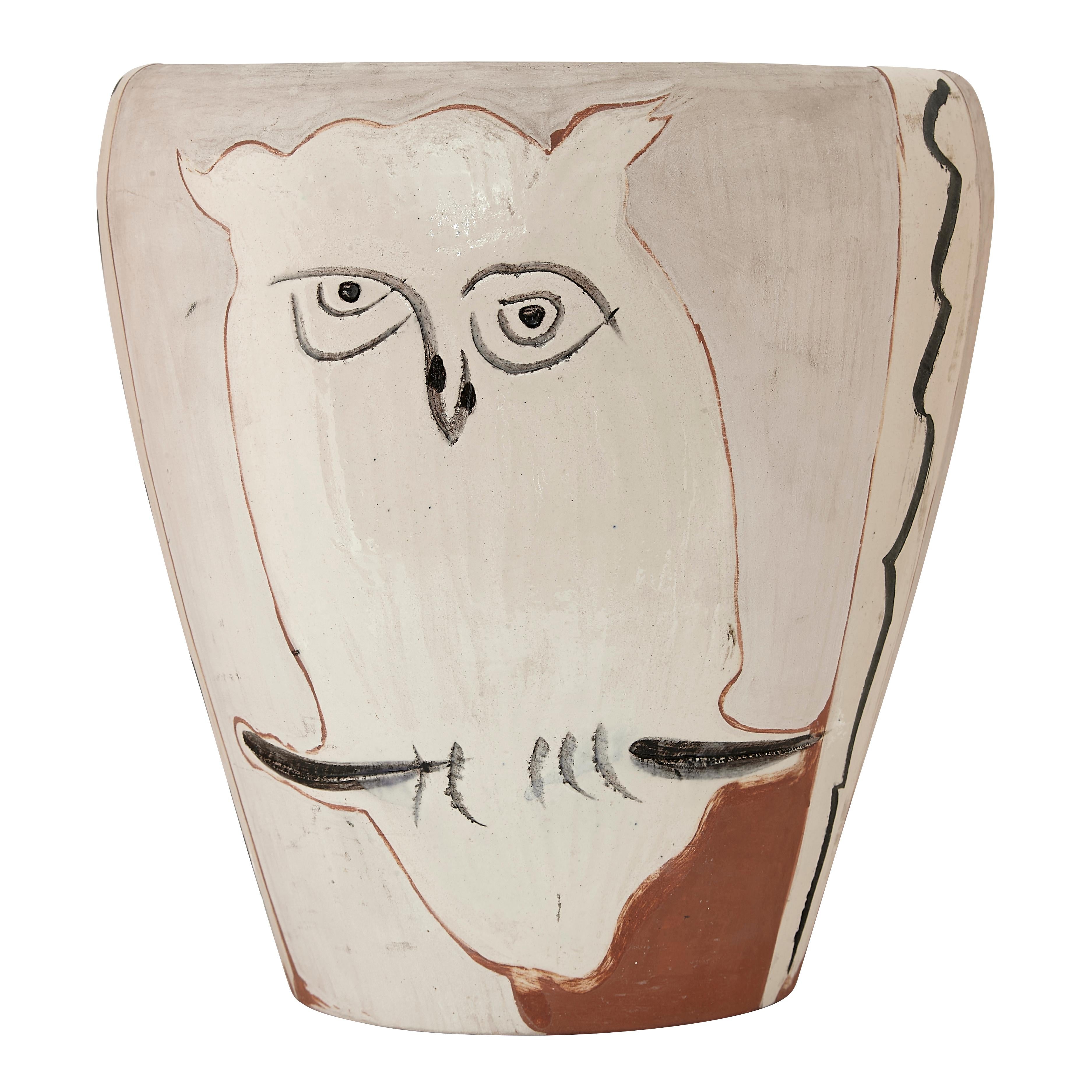 PABLO PICASSO (1881-1973) 
Visage et Hibou (A. R. 407) 

Terre de faïence vase, painted in colors and partially glazed, 1958, numbered 92/200 and inscribed 'Edition Picasso', with the Edition Picasso and Madoura stamps.