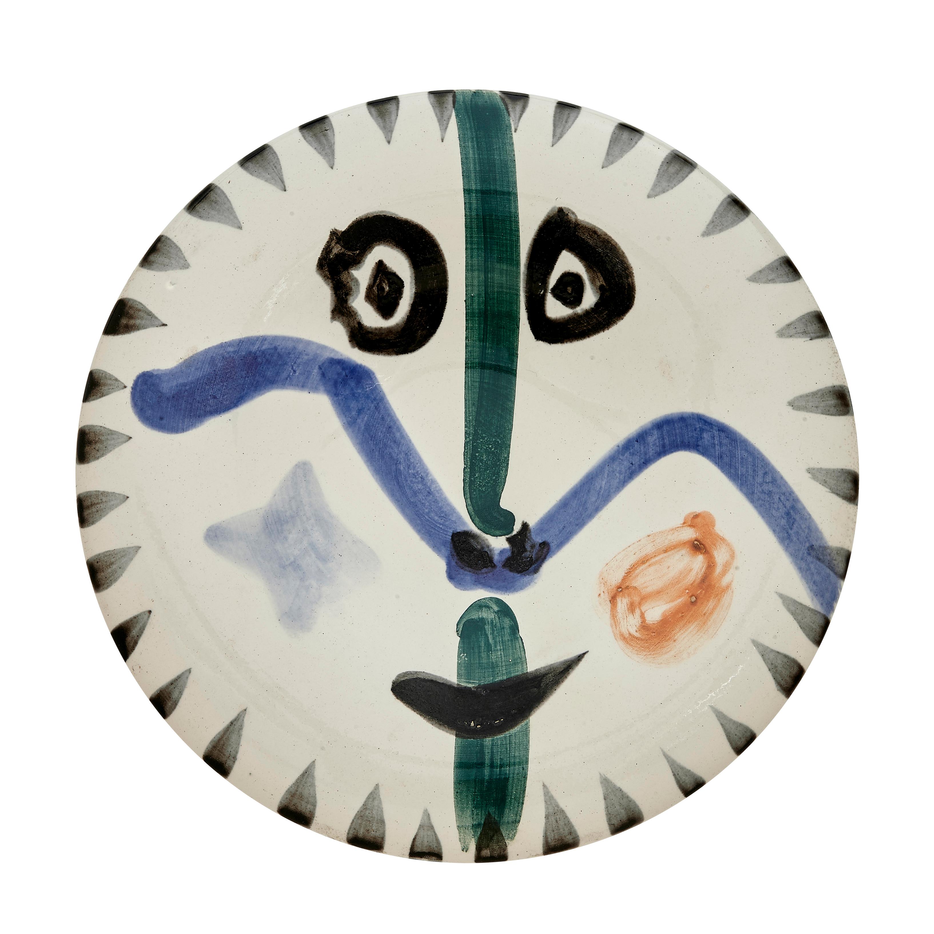 PABLO PICASSO (1881-1973) 
Visage No. 111 (A. R. 476) 

Terre de faïence plate, 1963, numbered 422/500, with the workshop numbering, inscribed 'Edition Picasso' and 'Madoura', glazed and painted.
