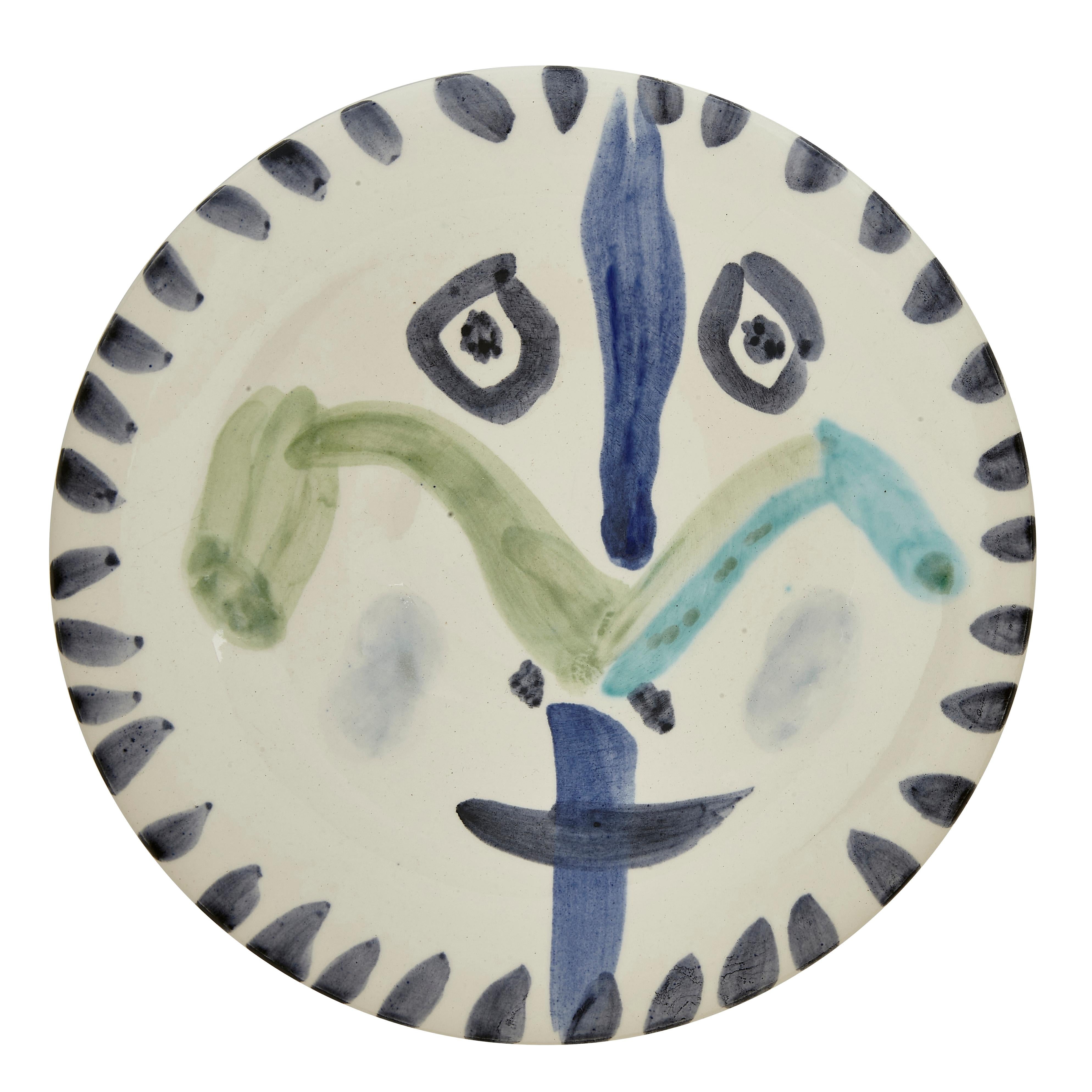 PABLO PICASSO (1881-1973) 
Visage No. 144 (A. R. 480) 

Terre de faïence plate, 1963, numbered 51/150 and inscribed 'Edition Picasso' and 'Madoura'.