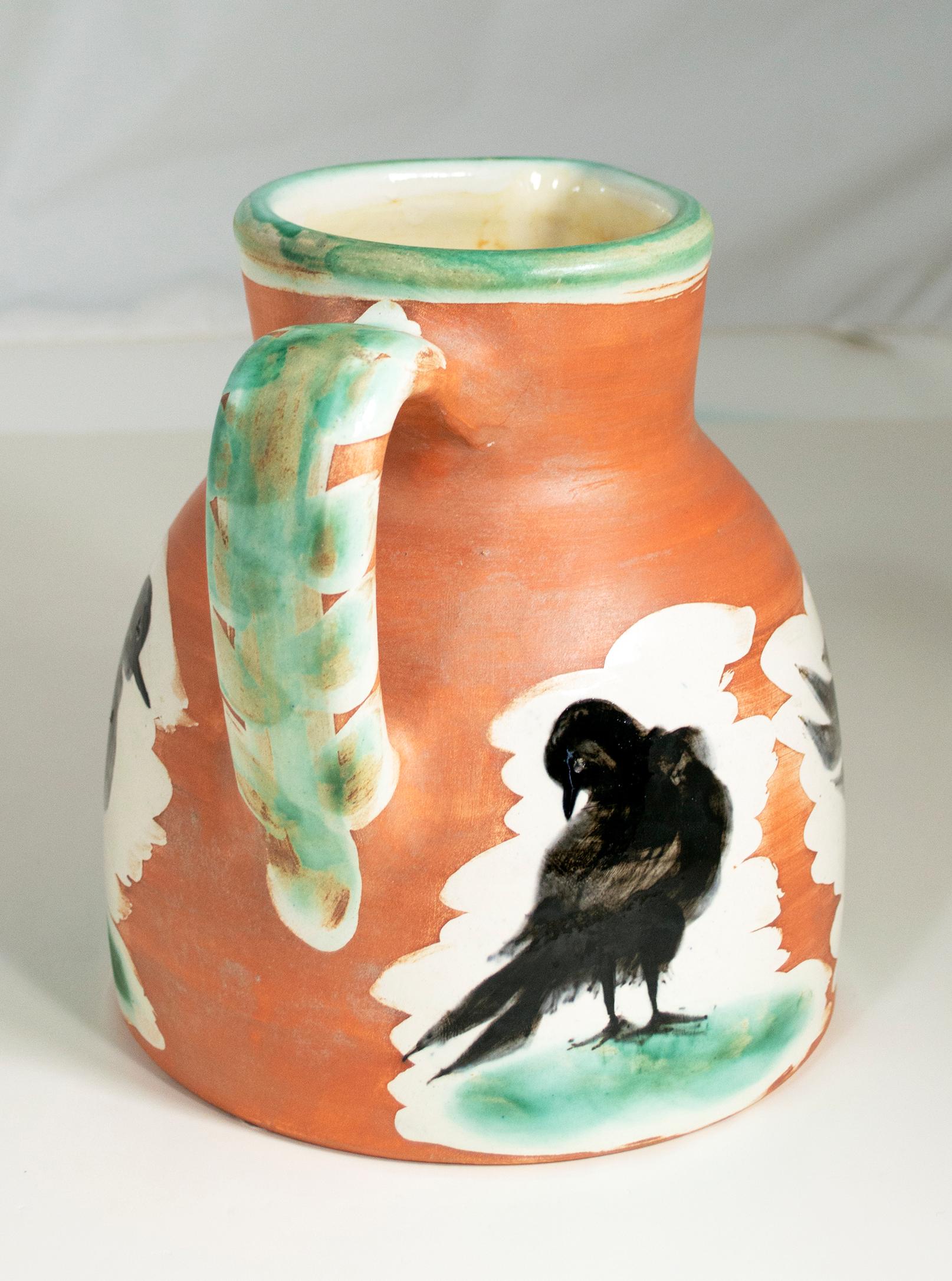 pitcher of birds