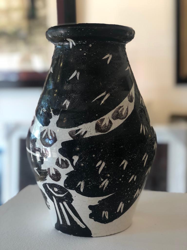 white ceramic owl vase
