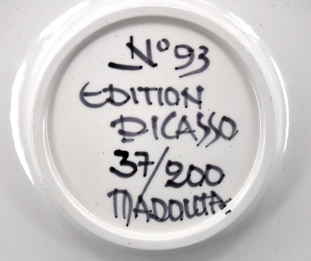 Created in 1963, this Madoura white earthenware clay round plate with engobe decoration (white, black) under partial brushed glaze with black patina is inscribed on the underside : ‘No 93,’ ‘EDITION PICASSO’ and ‘MADOURA’ and is numbered from the