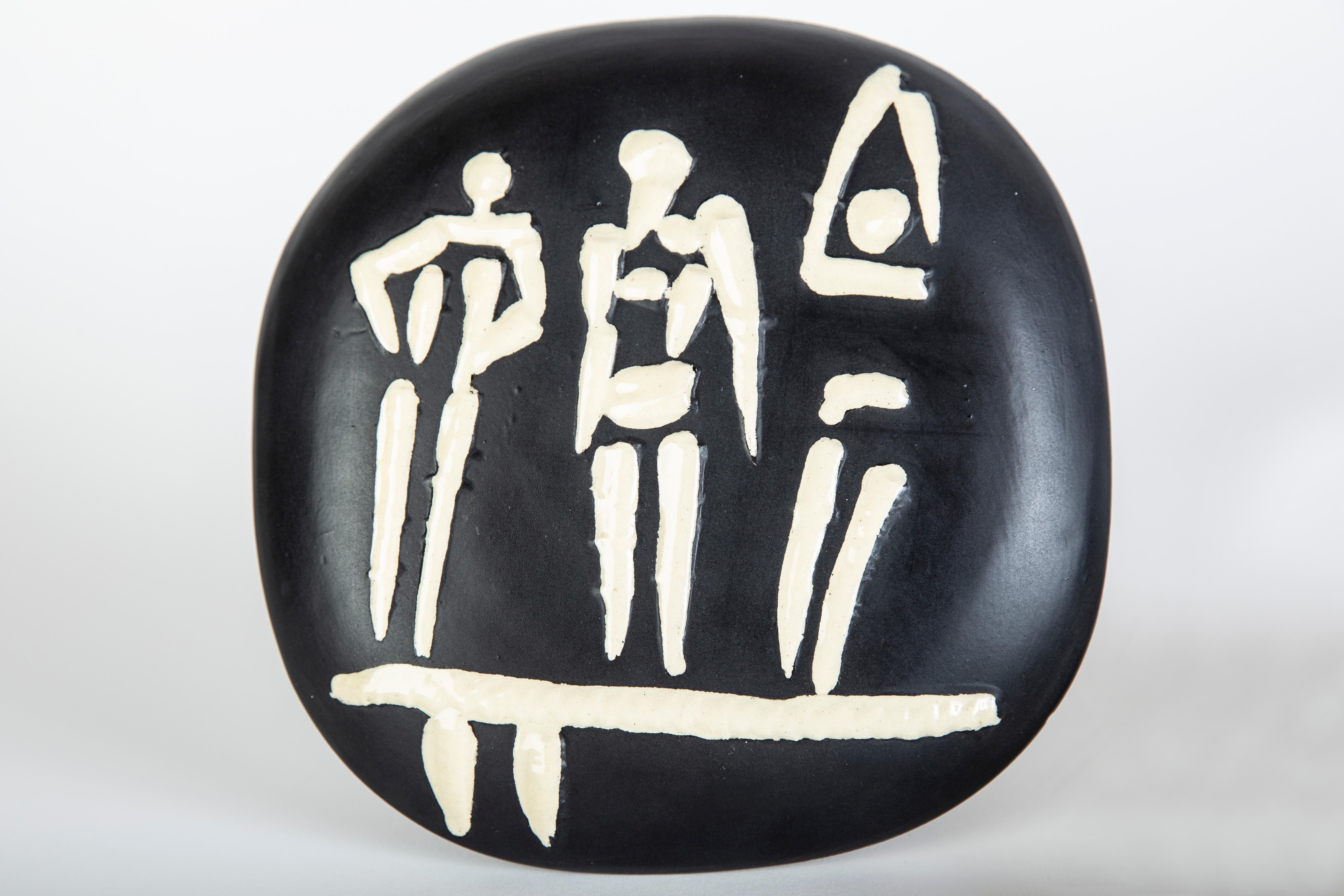 Artist: Pablo PIcasso
Title: Trois Personnages Sur Treplin
Medium: Partially Glazed Ceramic
Size: 7 5/8" x 7 5/8"
Edition Picasso stamped xxx/500
Year 1956

Pablo Picasso Trois Personnages sur Tremplin (Three Figures on a Spring Board), 1956 is a