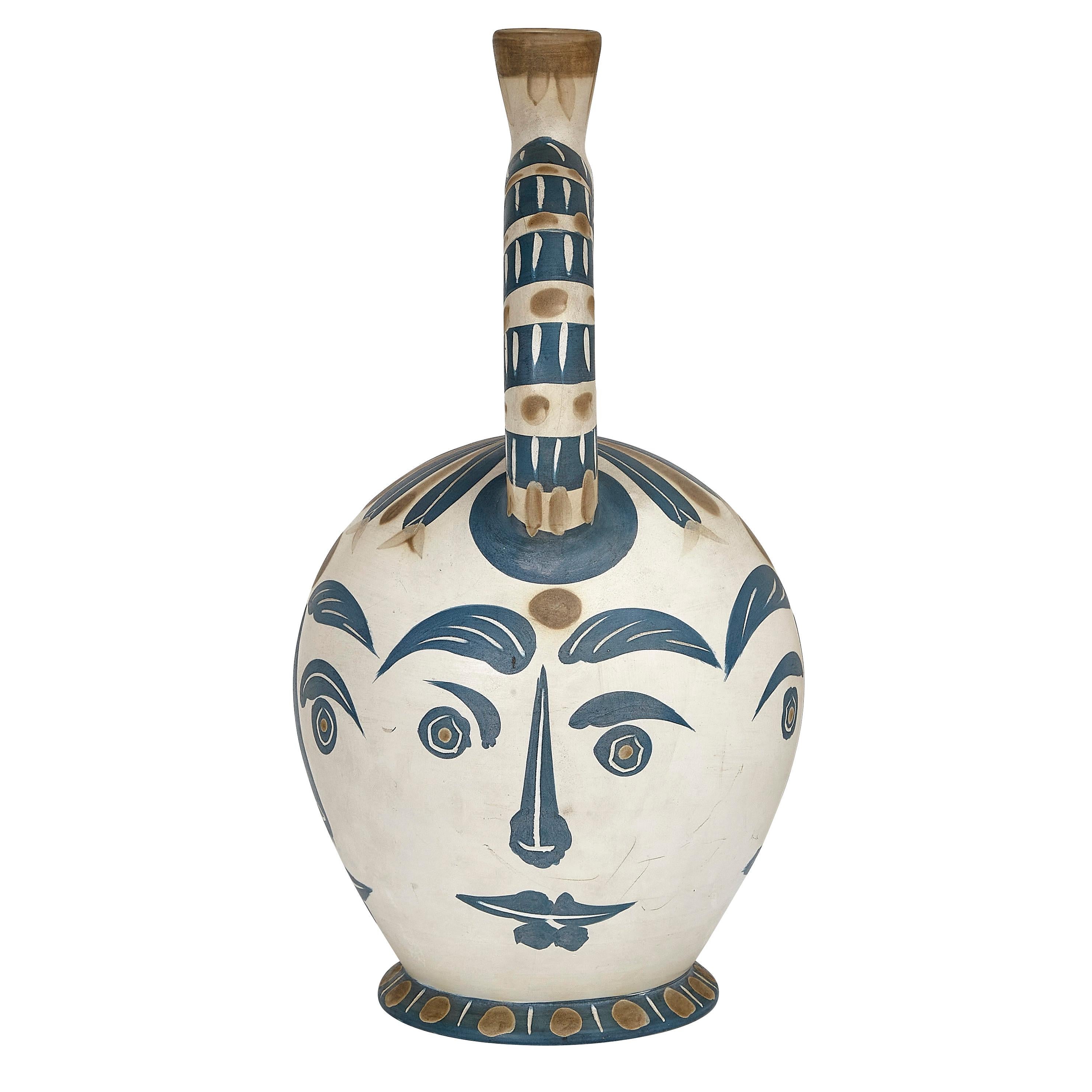 PABLO PICASSO (1881-1973) 
Vase aztèque aux quatre visage (A. R. 402)

Terre de faïence vase, painted in colors and partially glazed, 1957, numbered 73/100 and incised 'Edition Picasso' and 'Madoura', with the Edition Picasso an Madoura stamps. 