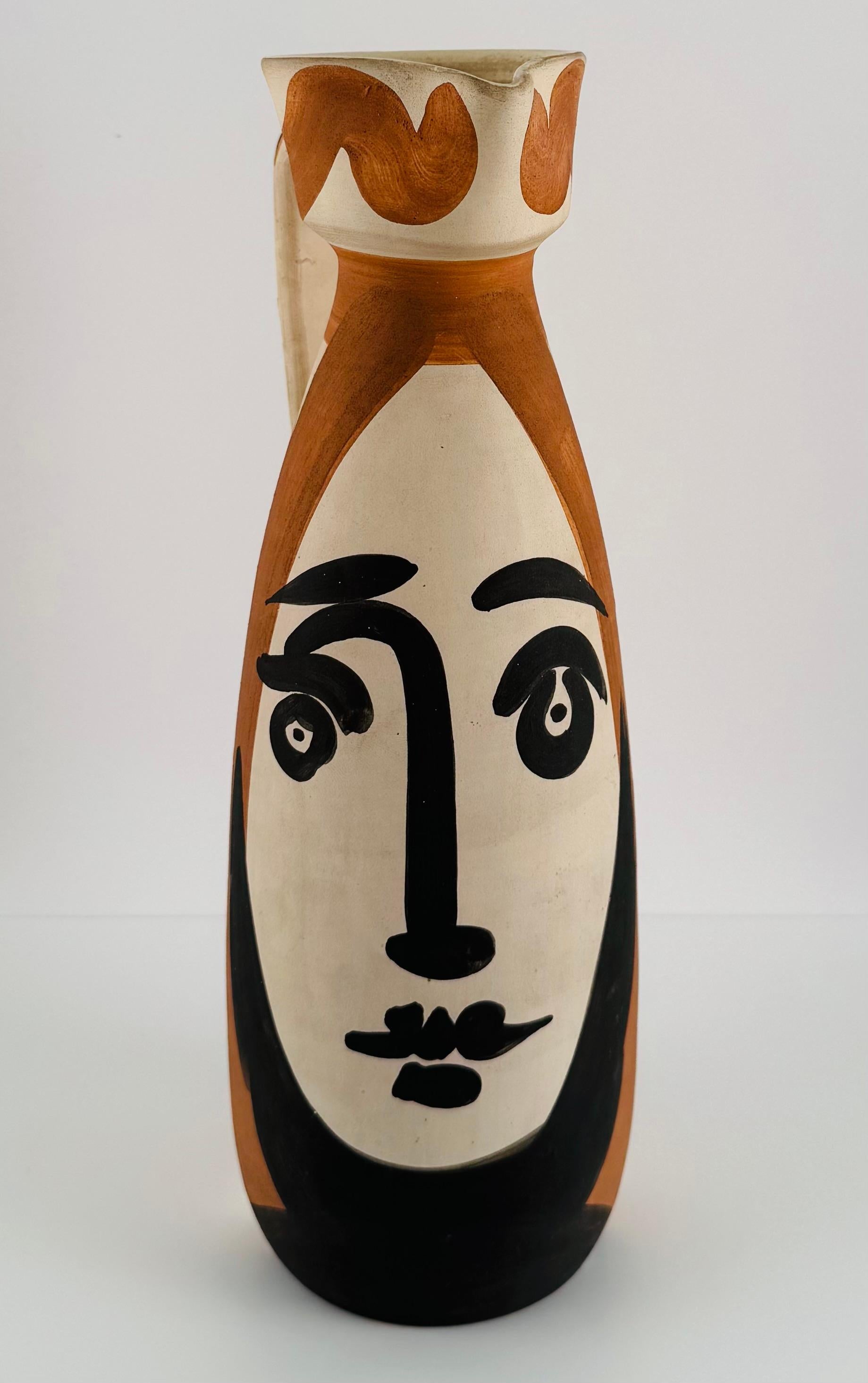 PABLO PICASSO (1881-1973)
Visage (A.R. 288)
timbrata e marcata "Edition Picasso / Madoura Plein Feu / Edition Picasso / Madoura" (sotto)
brocca in ceramica di terracotta bianca con ingobbio e smalto colorato
Altezza: 12 pollici (30 cm)
Concepito nel