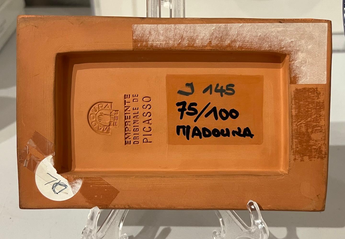 Created by Picasso during his time at the Madoura Foundry in Vallarius, France, Petit Soleil (“little sun”) was created by the artist in 1968/69.  Measuring 4 x 6 3/8 in. (10.4 x 16.6 cm.) , this three-dimensional terracotta plaque with extensive