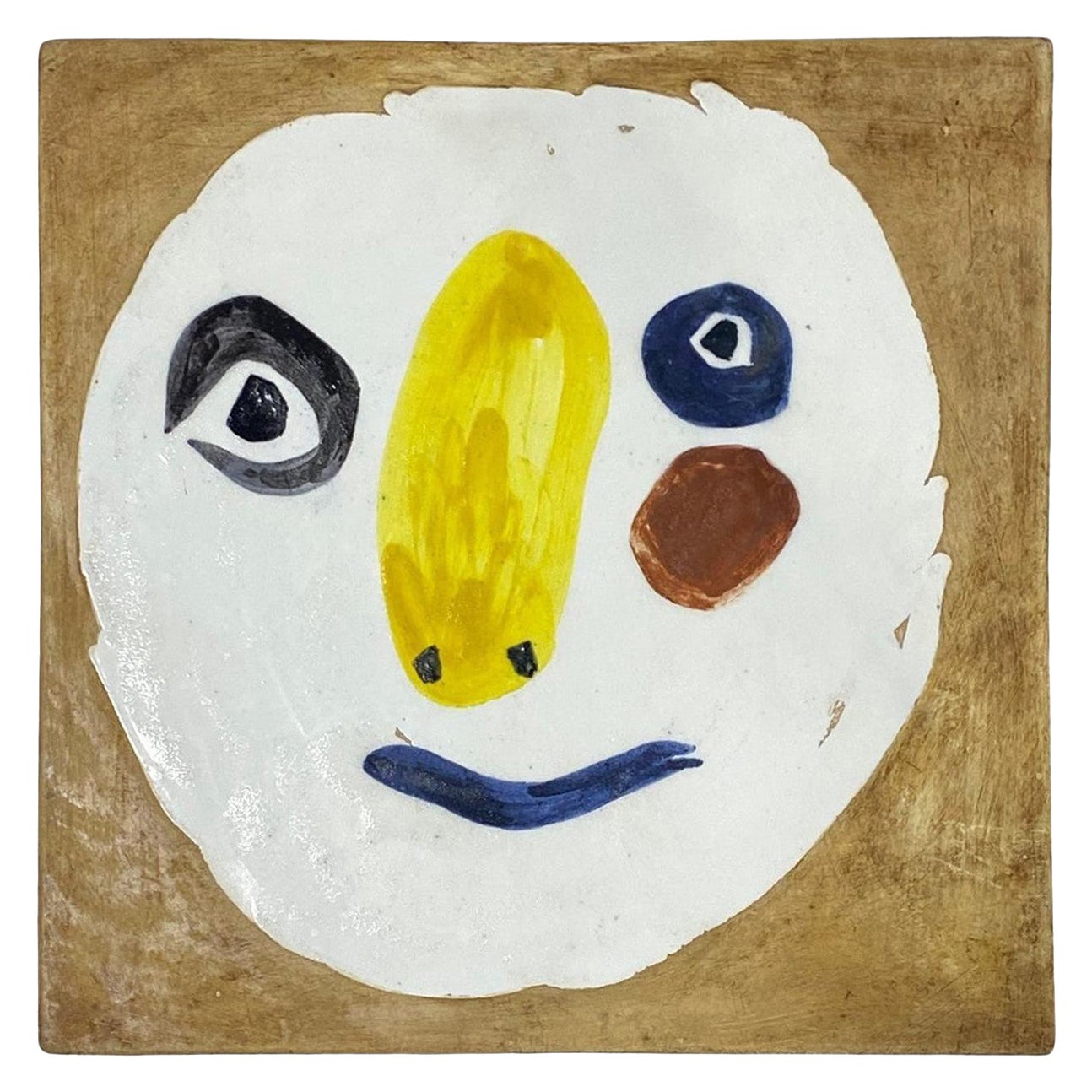 Pablo Picasso - Plaque en céramique signée Madoura
Tête Polychrome
Ramié 455