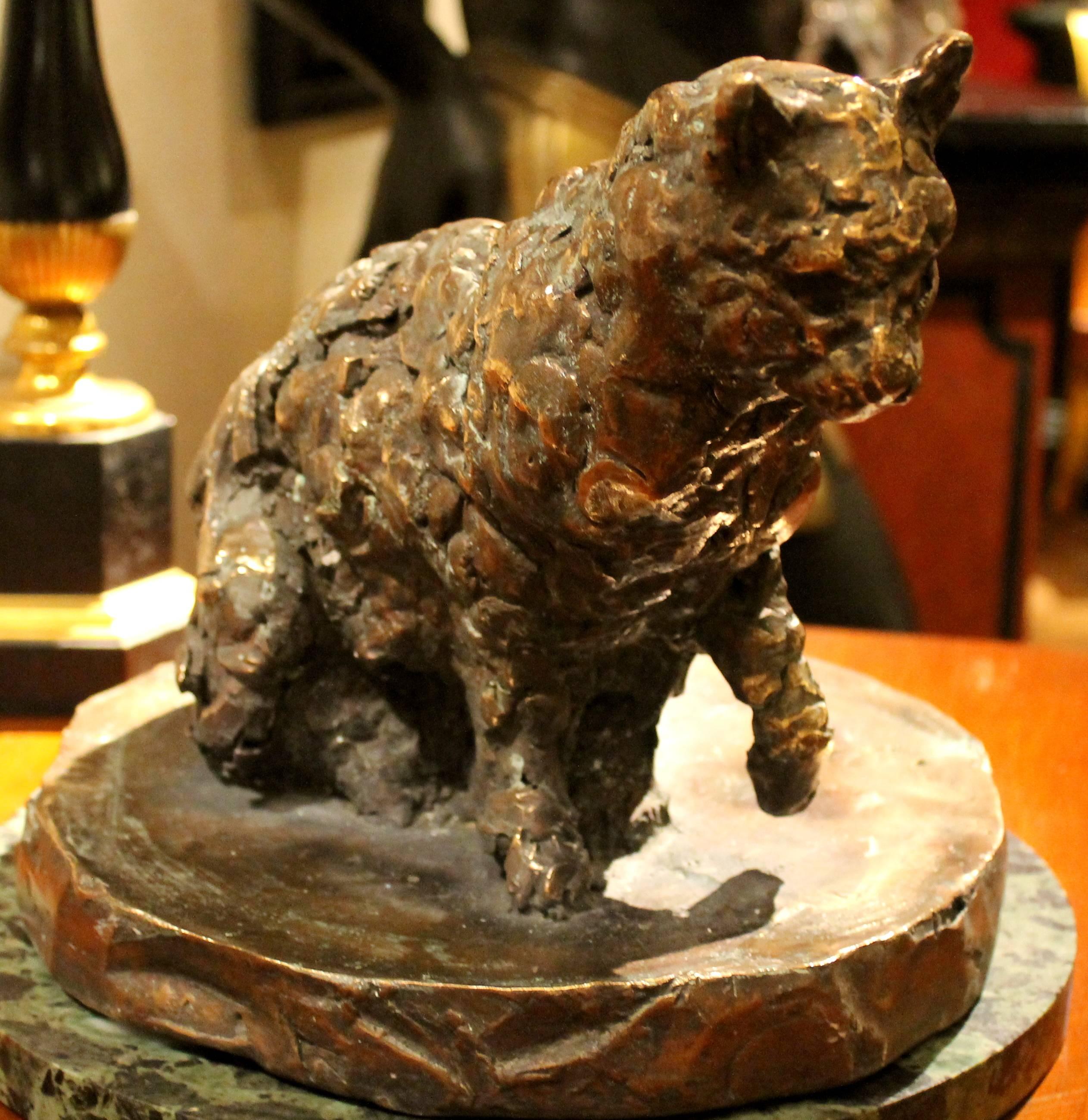 This exquisite solid bronze sculpture of a cat on a round base is handmade with incredible detail, the artist is able to capture a moment frozen in time but on the same time simultaneously creates both movement and static effects. The animal