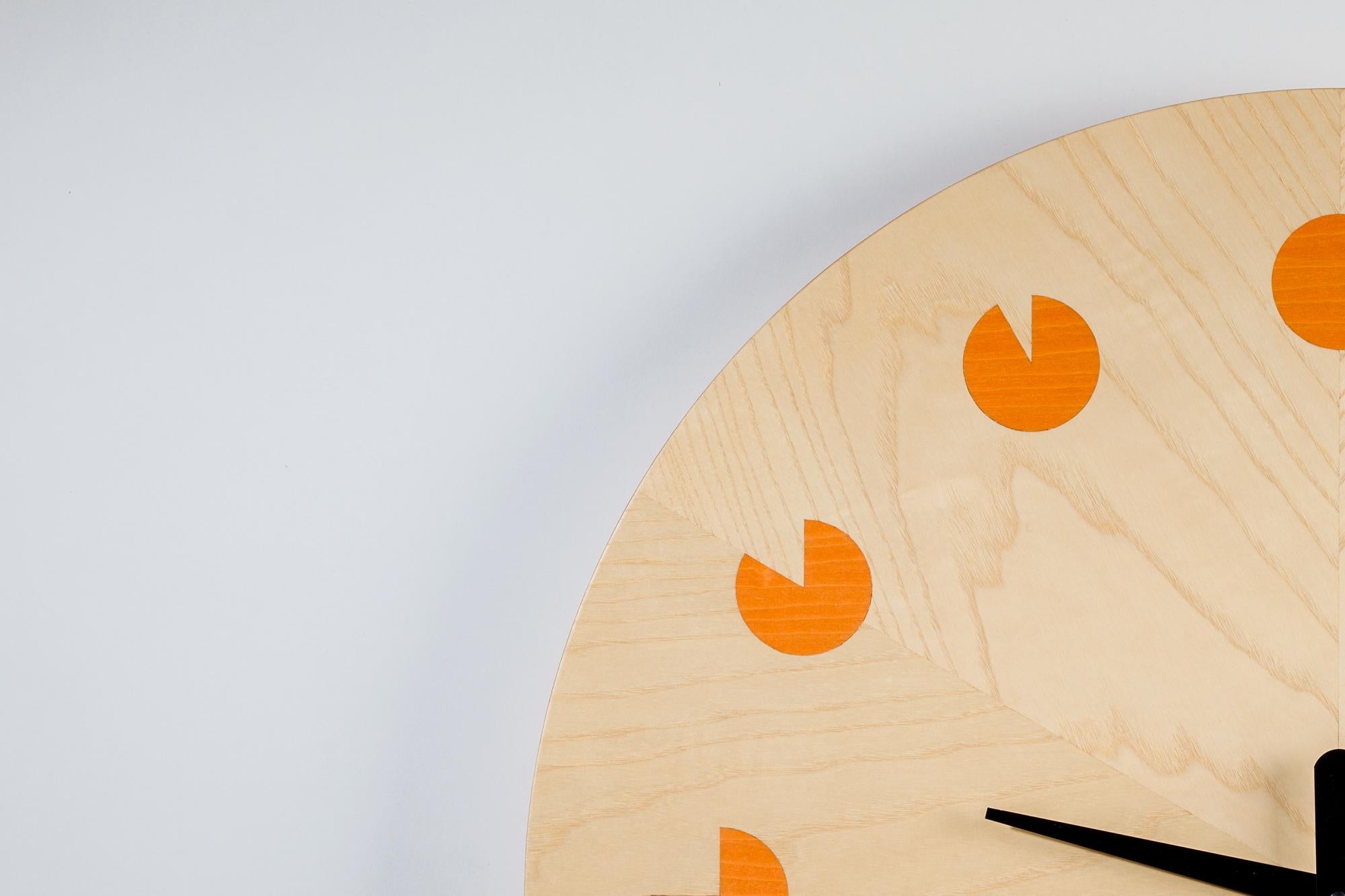 Transform your space with these enchanting wall clocks that effortlessly combine artistry and functionality. The clocks boast a captivating design, featuring a meticulously arranged ash veneer meticulously shaped into a regular form, accentuated by