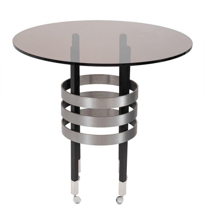 Pace Attributed Smoked Glass Top Side Table, with circular steel bands attached to four patinated black aluminum legs on four casters. 30.5