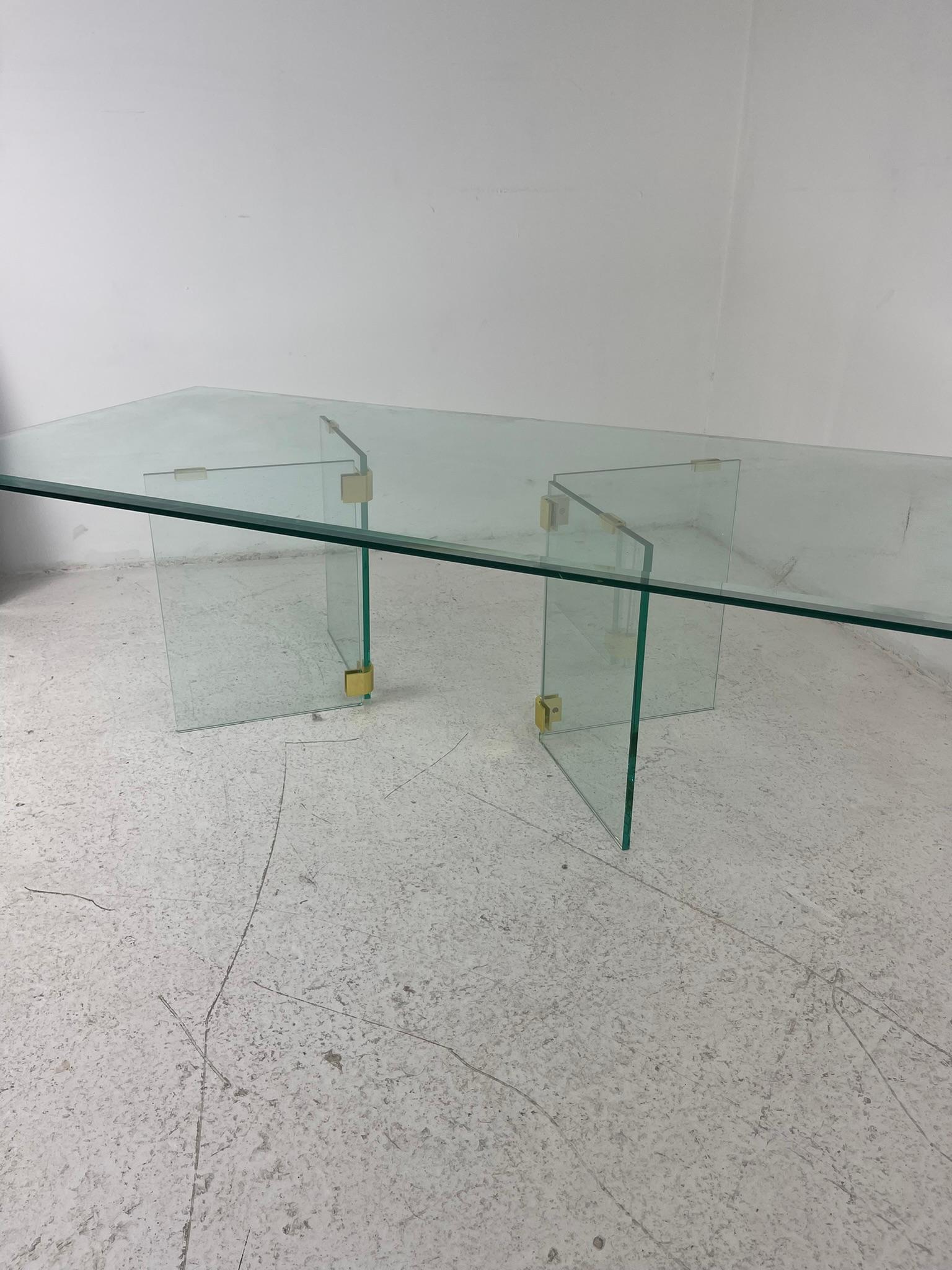 Disco chic coffee table by Pace Collection. 2 glass and brass pillars create a sturdy foundation for heavy beveled rectangular glass and can be adjusted to desired look.

Bases have some minor chips to edges of glass, but no major cracks/breaks.