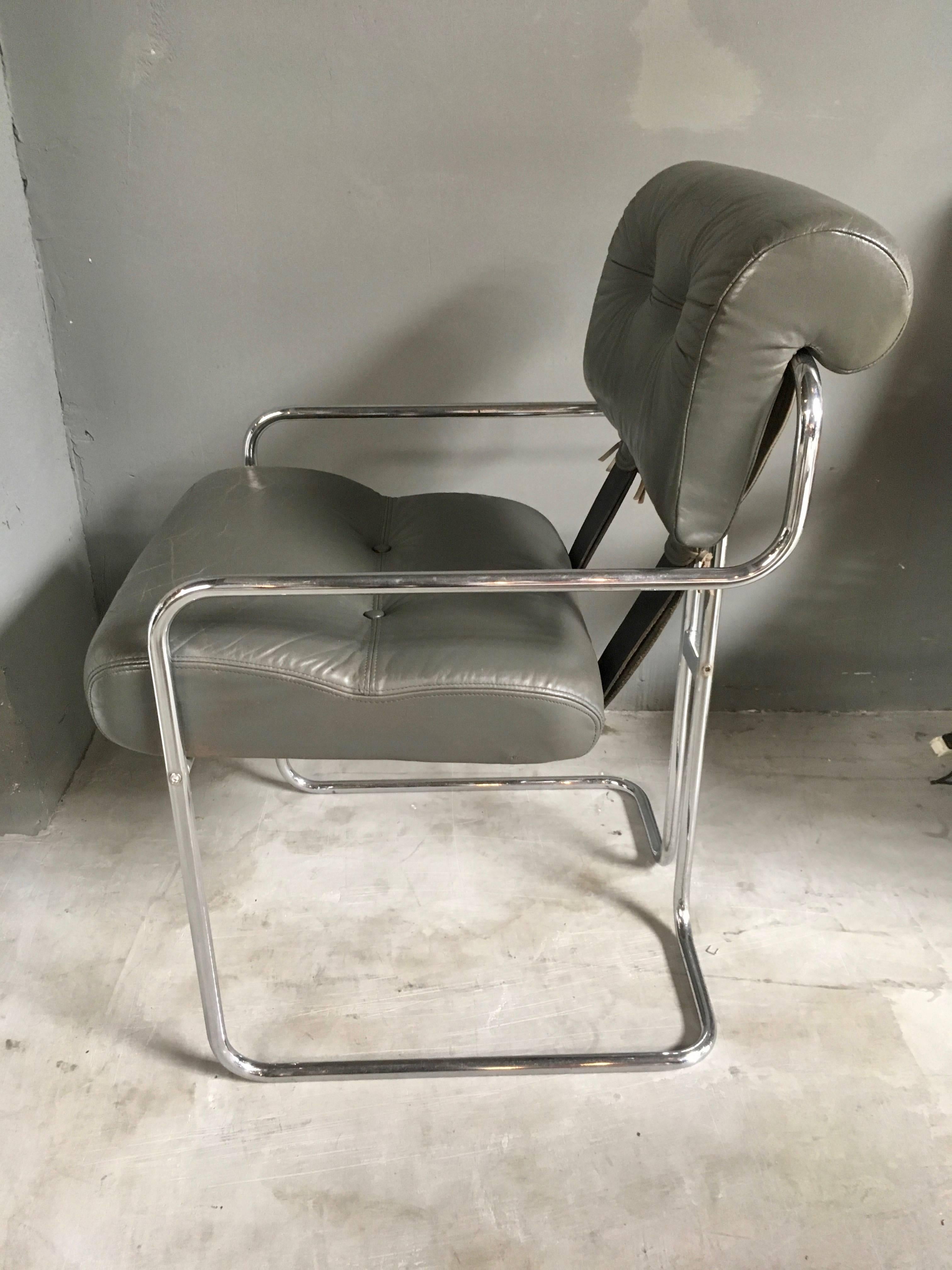 Classic leather chair by Guido Faleschini for Pace. Chrome chair with grey leather. Great color and patina to leather. Extremely comfortable chairs. Repair on seat. Only one available.