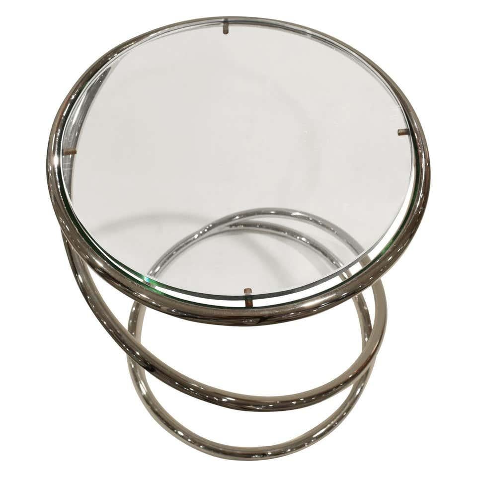 Timeless chrome spiral drinks or cigarette table with inset glass top. Excellent condition.