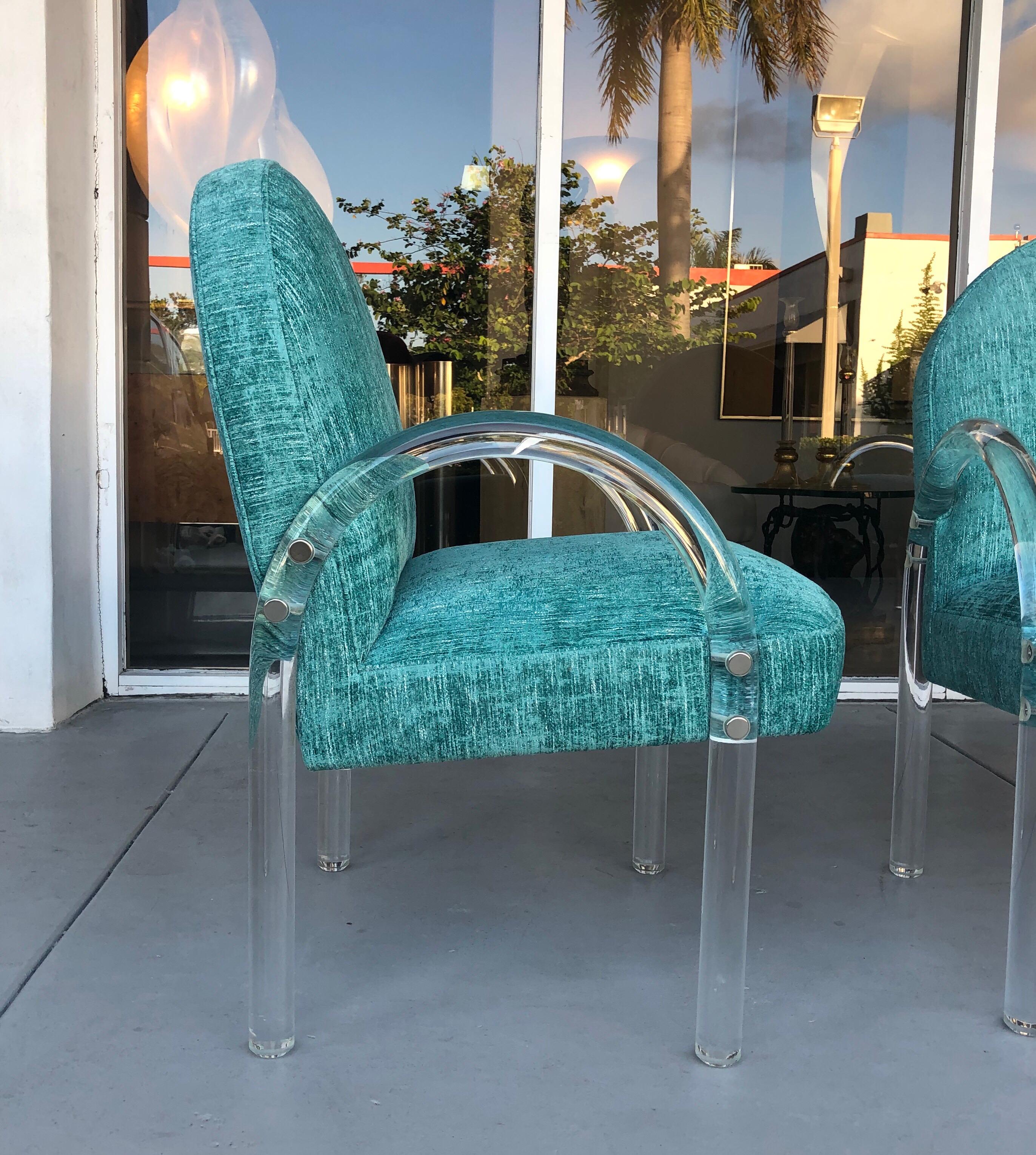 A set of 6 chairs by Pace. Thick Lucite arms and upholstered seats. The design is clean and to the point. The chairs are well proportioned and comfortable, not the usual narrow and skinny dining chair. Could also be used as occasional lounge chairs.