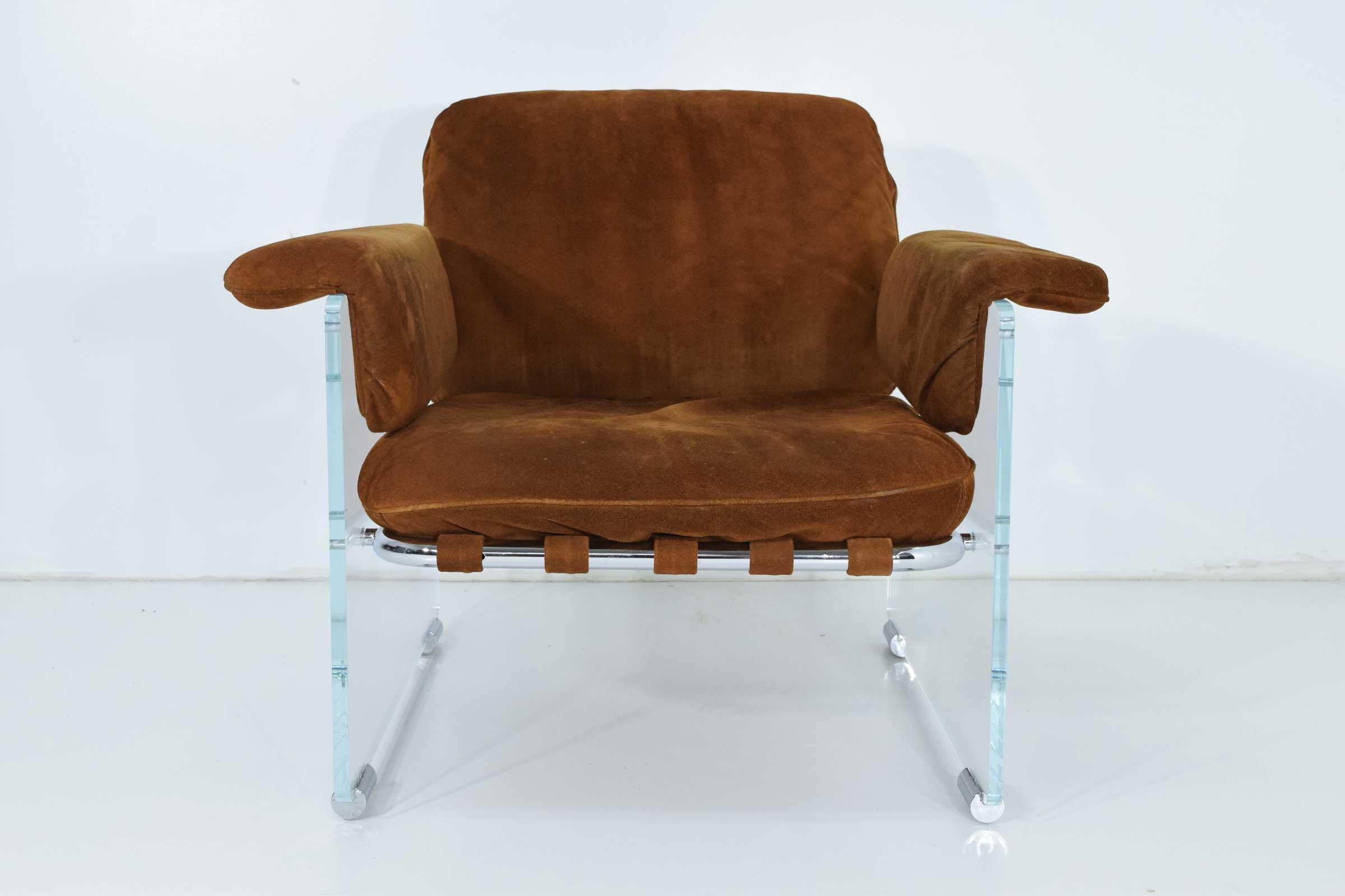 This amazing 1970s Pace Collection lounge chair feature thick Lucite panels with chrome details. Straps wrap the tubular chrome frame to support the cushions. This chair is upholstered in a suede which can be cleaned up or reupholstered in your