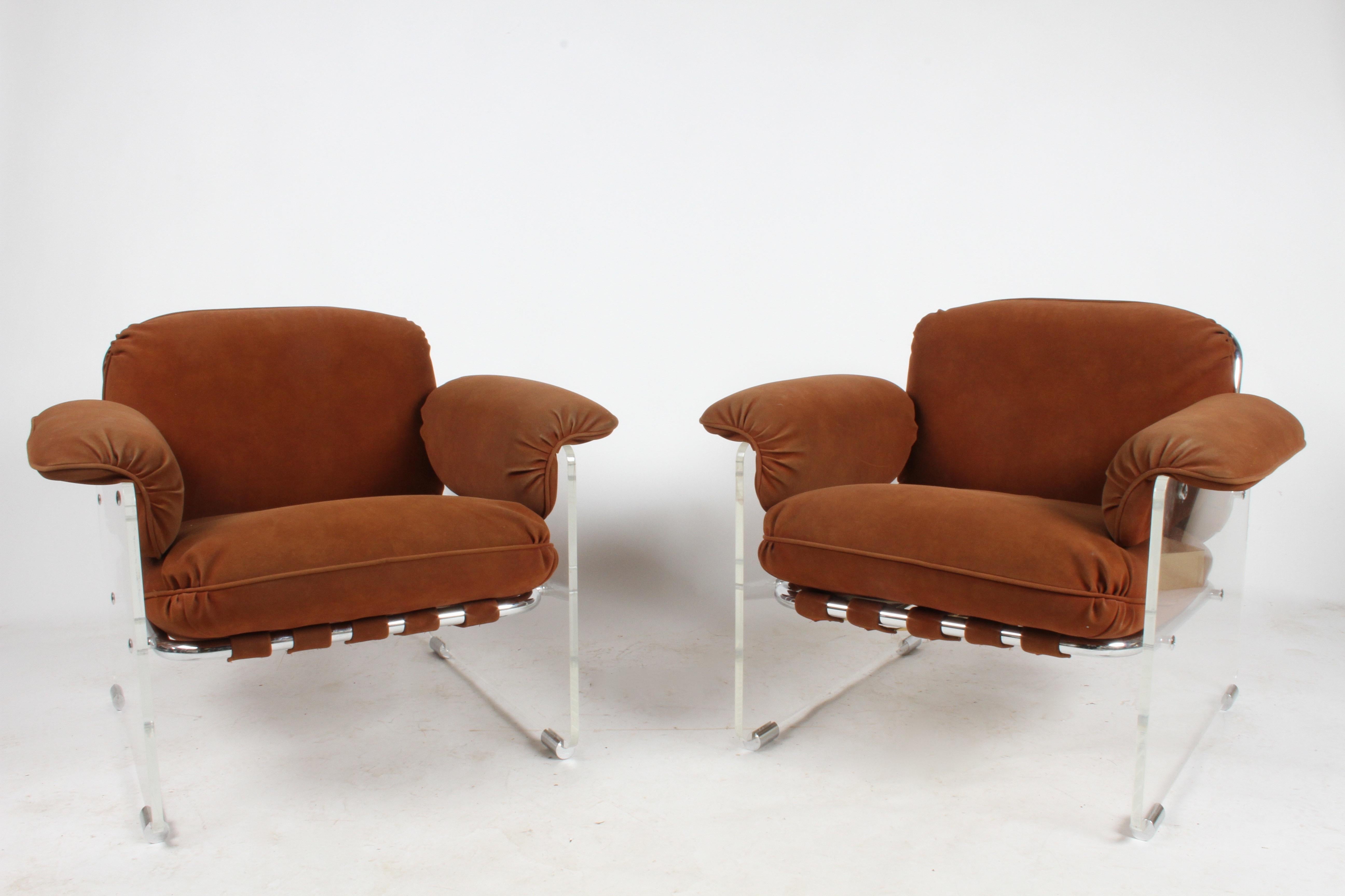 Pair of Pace collection Argenta club chairs with thick Lucite panels, original rust colored suede and tublar chrome framing. 1970s styling at its best and very comfortable too. Original suede shows some wear and age, may want to update. Lucite has