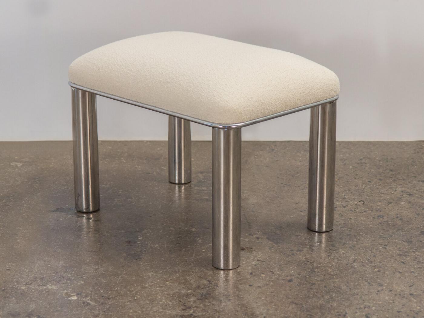 Glamorous rectangular ottoman with polished chrome base from Pace Collection. A playful, rounded form with chubby, tubular legs. The plush seat cushion has been newly replenished and upholstered in luxurious Knoll boucle in Pearl. Excellent