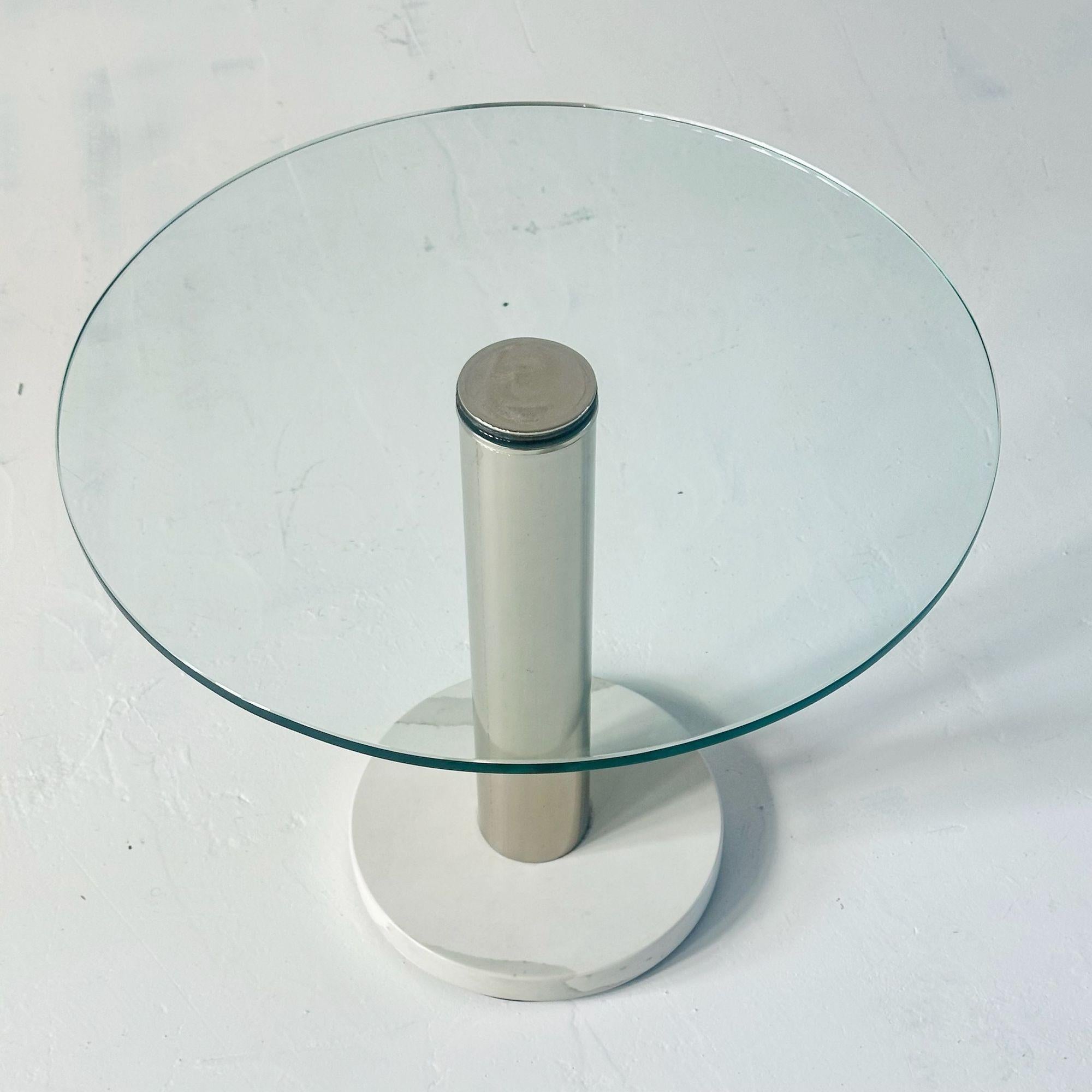 PACE Collection Carra Marble Chrome and Glass Side/End Table, 1970’s.   Excellent original condition.
Measures 17.25” tall 20” diameter