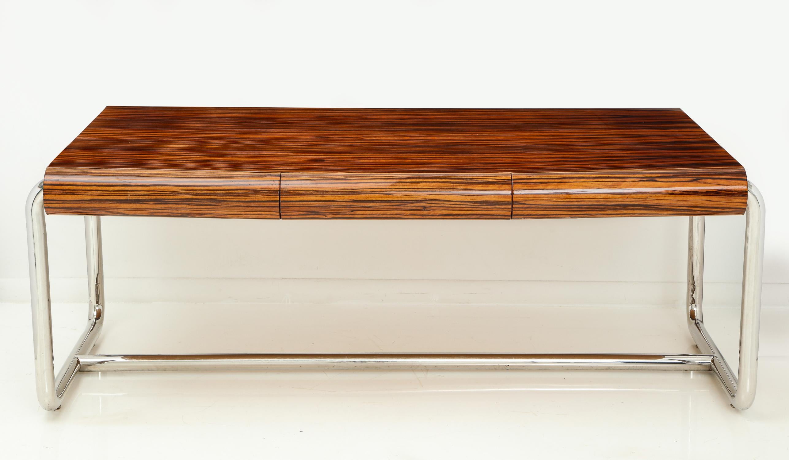 Impressive executive desk in Macassar ebony and chrome with solid oak secondary wood in the drawers. A Leon Rosen design for the Pace Collection, circa 1980s. Uncommon in Macassar. The original hard urethane finish is intact. It has been cleaned and