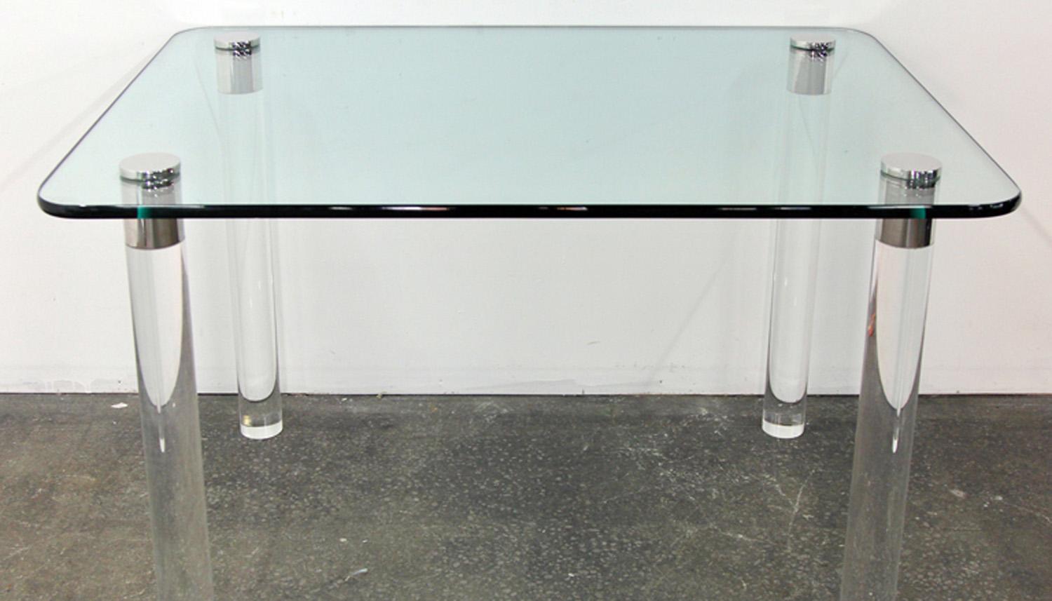 Gorgeous and light midcentury table. Lucite legs capped over the top with chrome. Legs easily removed for shipping. Beautiful statement piece.