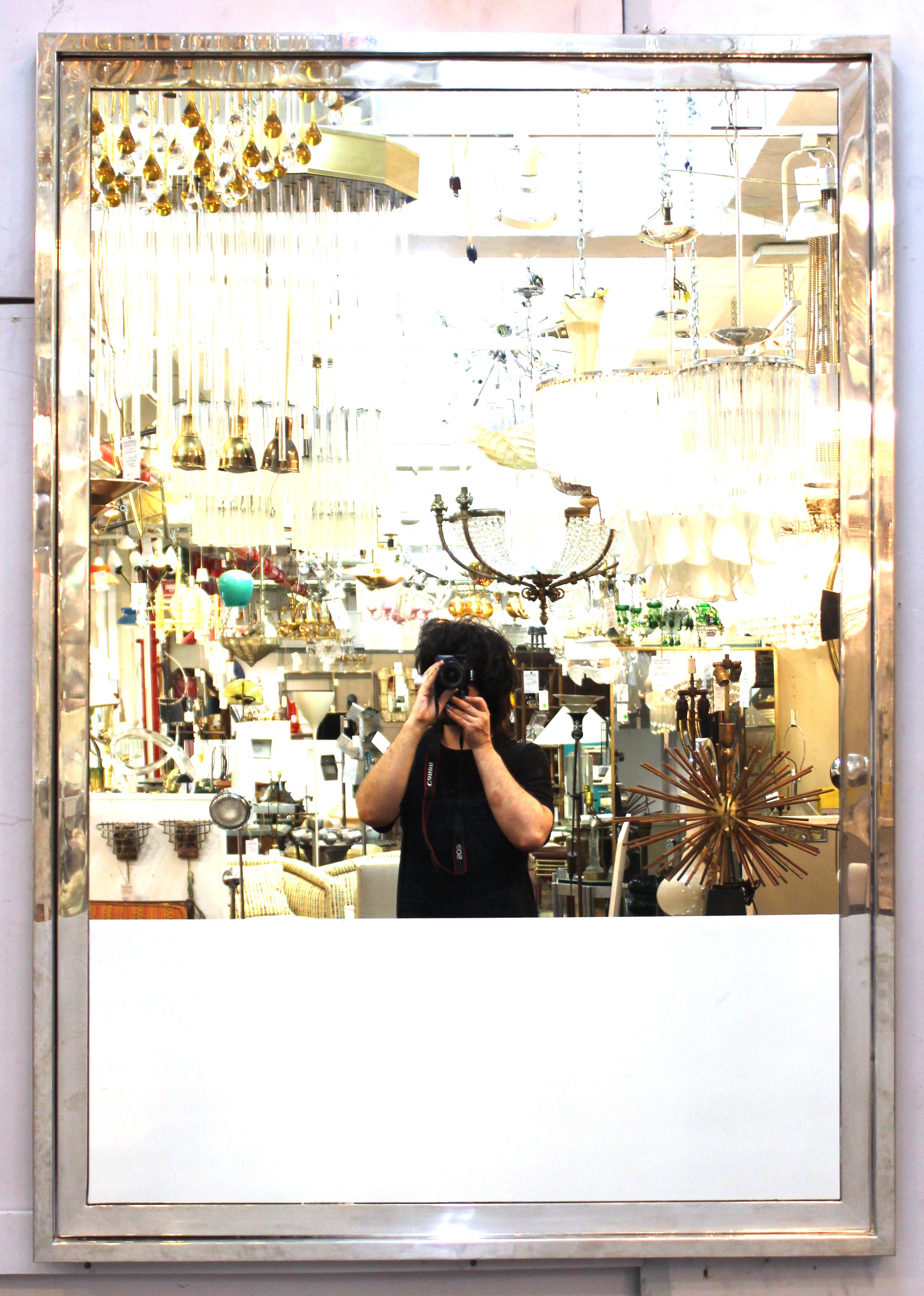 Modern chromed metal frame wall mirror by Pace collection, made during the mid-to late 20th century. A pace mark is on the back frame. The piece is in great vintage condition with age-appropriate wear.
