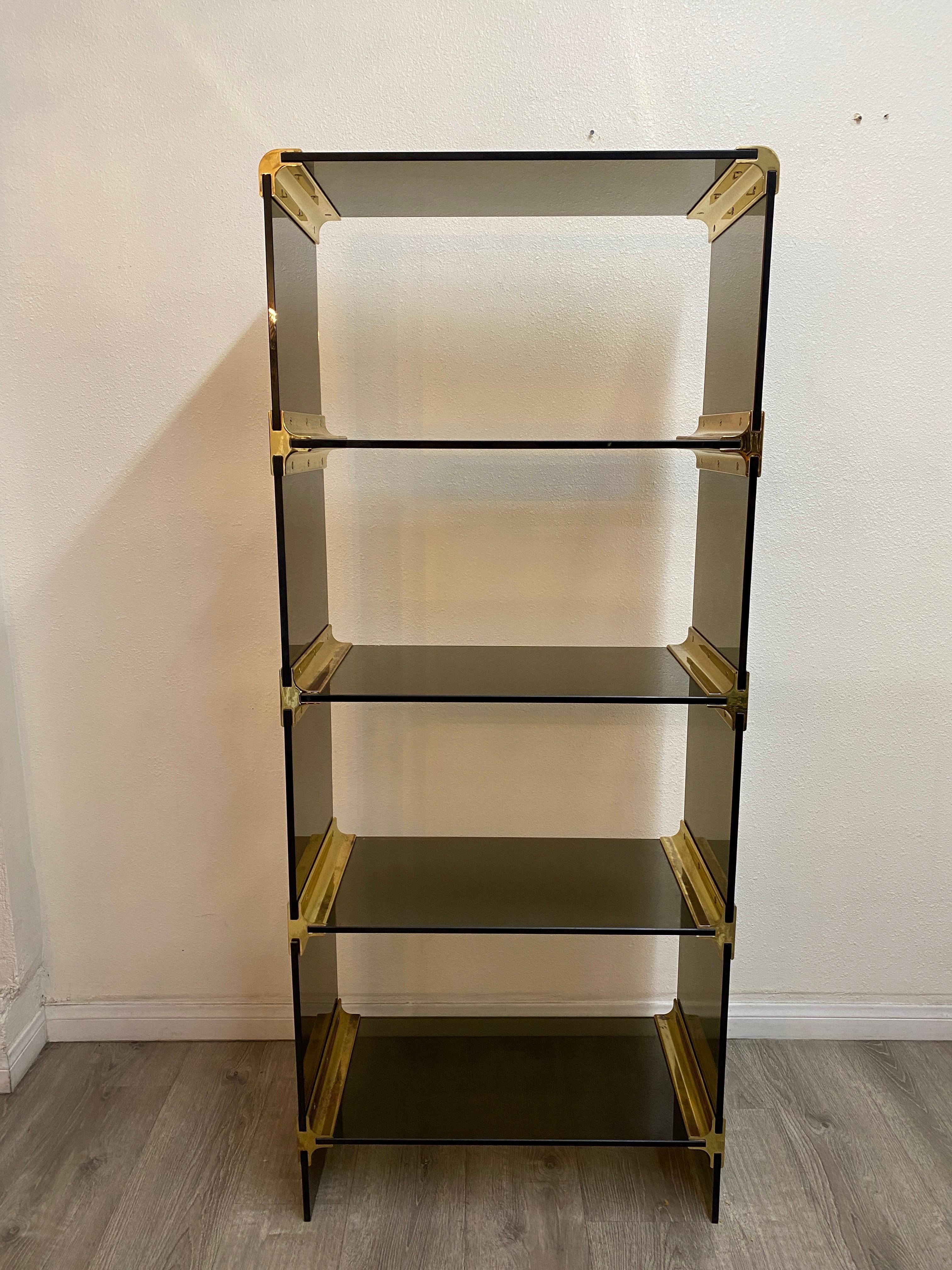 Pace collection smoke glass and brass etagere.