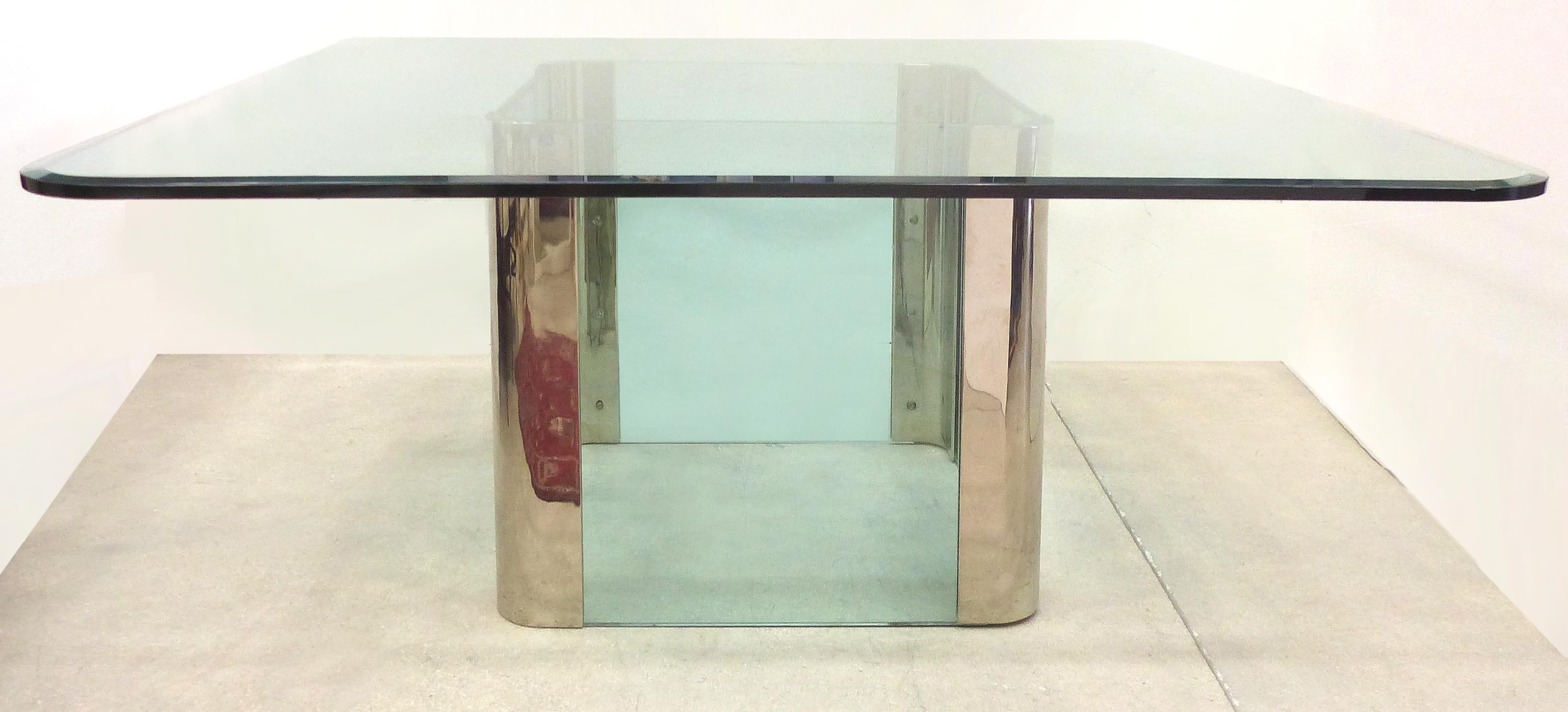 Leon Rosen Pace Collection Square Dining Table 

Offered for sale is a large square stainless steel and glass dining table designed by Leon Rosen for the Pace Collection. The glass is thick with rounded corners and a wide bevelled edge.