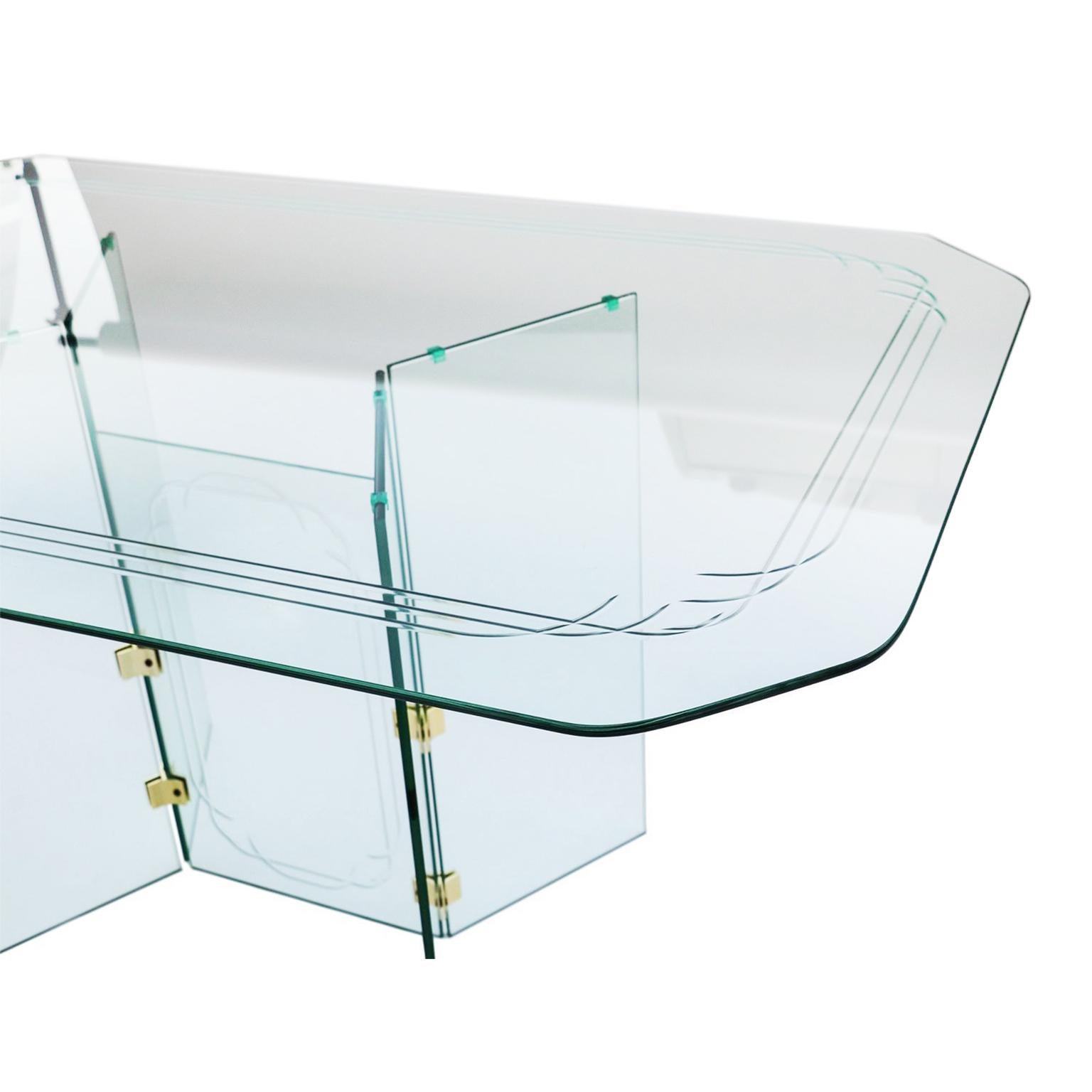 This 1960s glass table in the style of Pace collection. A substantial table that is suitable for many styles of interiors. The rounded rectangular glass top incised with three overlapping rounded rectangular lines, raised on two pairs of thick glass